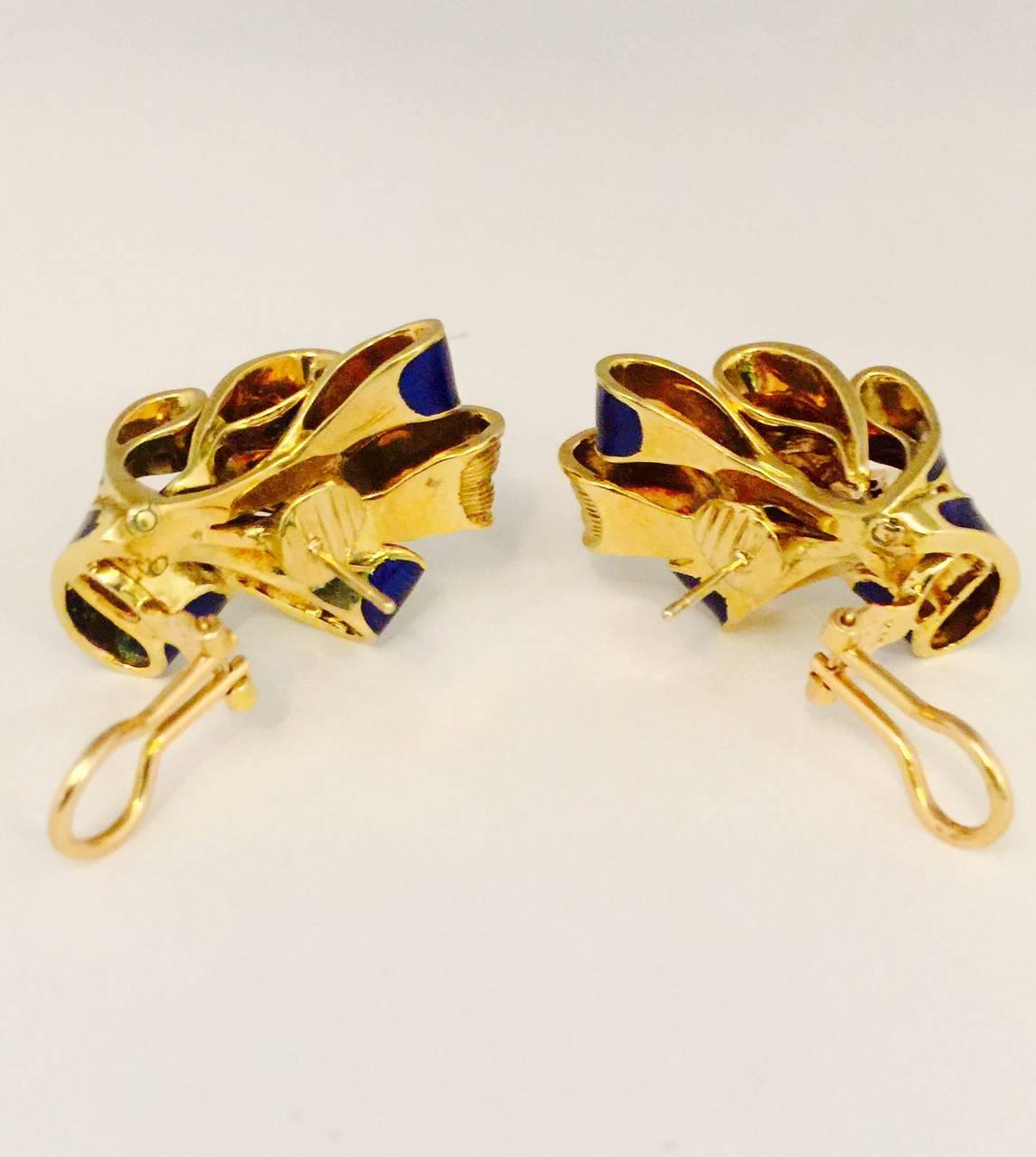 Every woman loves Tiffany!  They are recognized world wide as leaders in the fine jewelry industry.  These fabulous 18 karat yellow gold pierced earrings feature Paillone enamel in the richest blue color possible.  Omega backs supply added security.