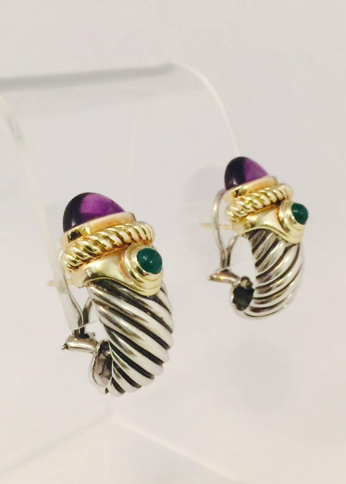 David Yurman has created a cable look that is instantly recognizable.  These fabulous Omega back pierced earrings feature the cable design as well as being topped by 14 karat yellow gold.  A bezel set cabochon amethyst is the focal point followed by