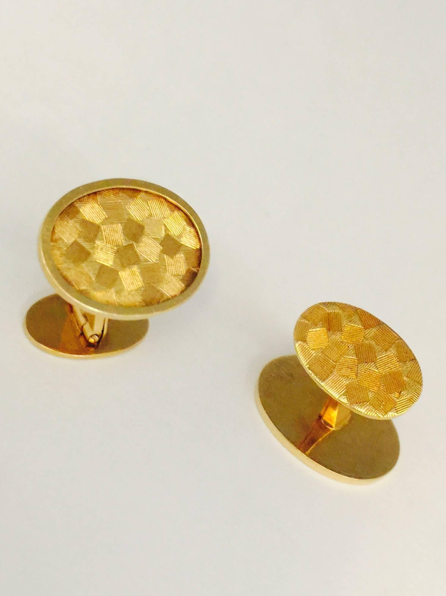 The name Cartier says Fine Jewelry!  These fabulous cufflinks date back to the 1960's but are fashionable today!  Suitable for ladies or gents!  Fabricated in 18 karat yellow gold, the cufflinks feature beautiful Florentine work on both front and