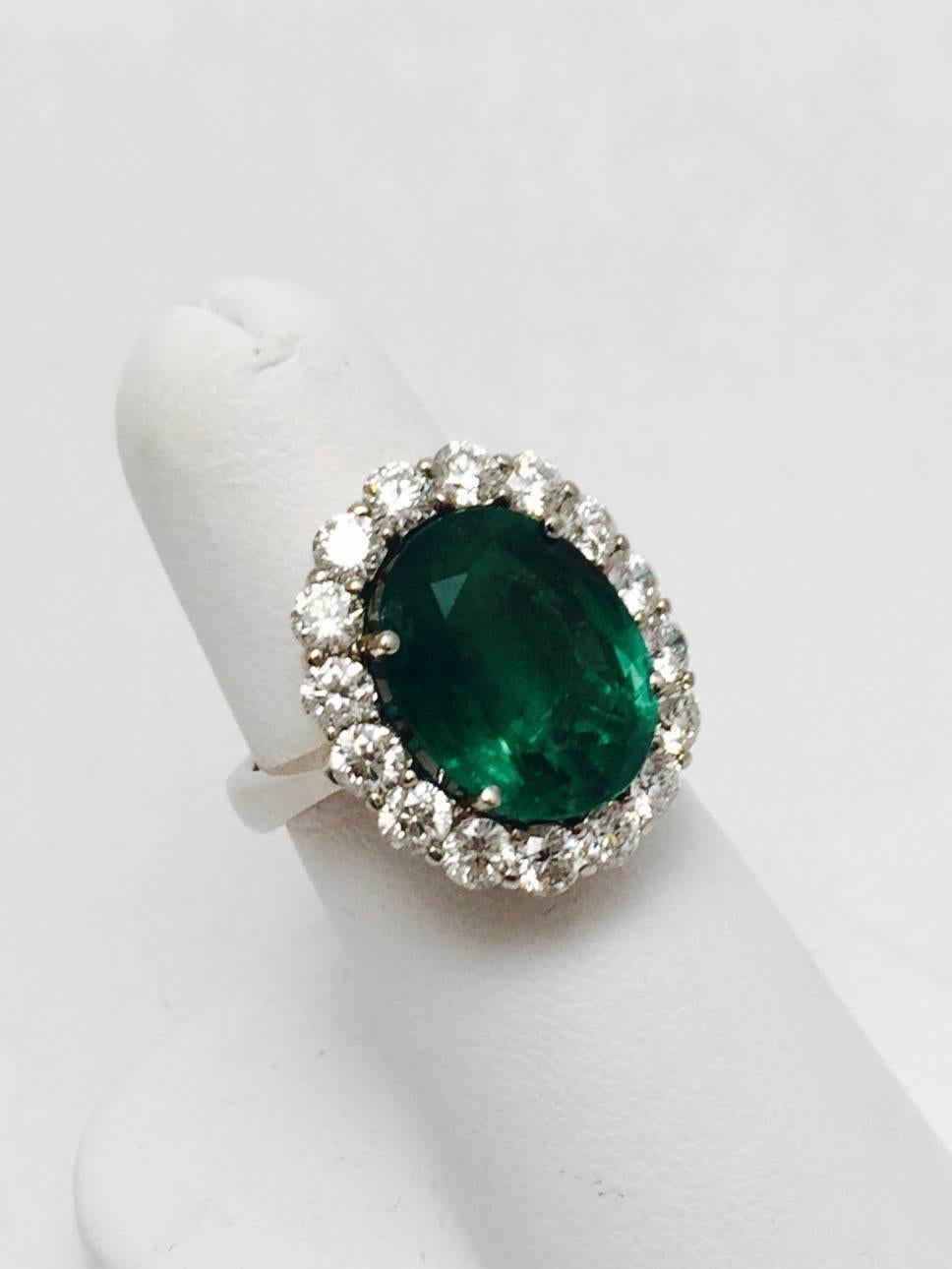 When fine jewelry is discussed, this 18 karat white gold ring is the topic of conversation!  Gorgeous Colombian oval emerald weighs 6.26 carats.  The color saturation is stunning.  A wreath of beautifully matched brilliant cut white diamonds adds an