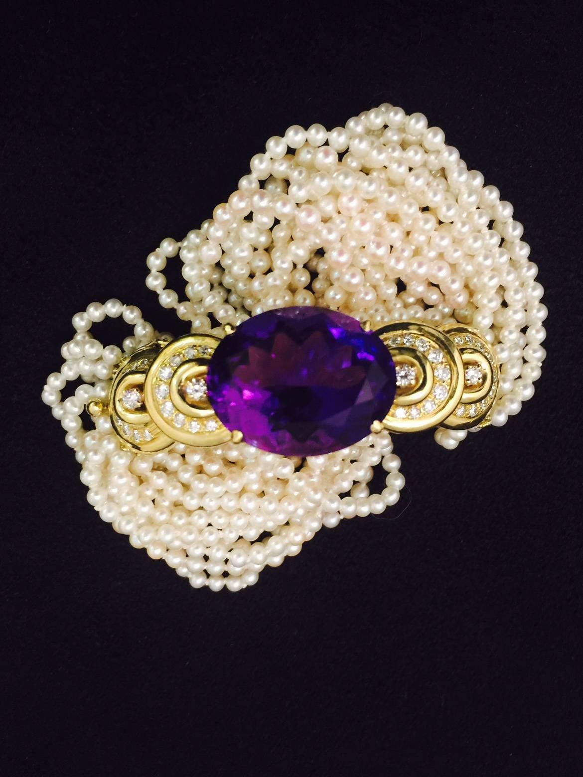 This amazing amethyst bracelet is a showstopper!  Begin with an impressive 14 rows of 3mm seed pearls.  Because these can be twisted torsade style the bracelet fits wrists from 7-7.5'.  An 18 karat yellow gold top section boasts an amethyst