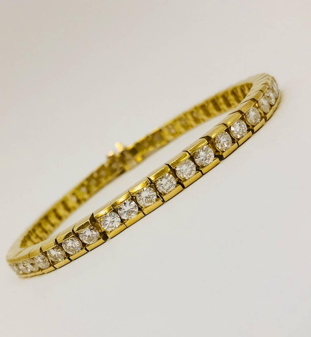 A fine jewelry wardrobe staple!  The ever recognizable, wear it with everything, diamond tennis bracelet!  Fabricated in 18 karat matte yellow gold, each diamond is individually channel set in their own box link.  This totally eliminates the chance