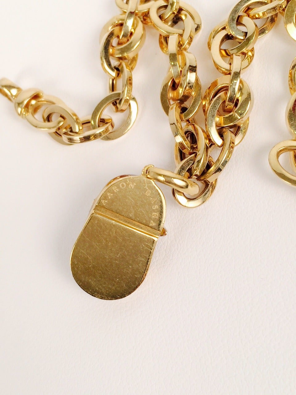 Modern Iconic Aaron Basha Enamel Diamond Gold Baby Shoe on Gold Charm Bracelet For Sale