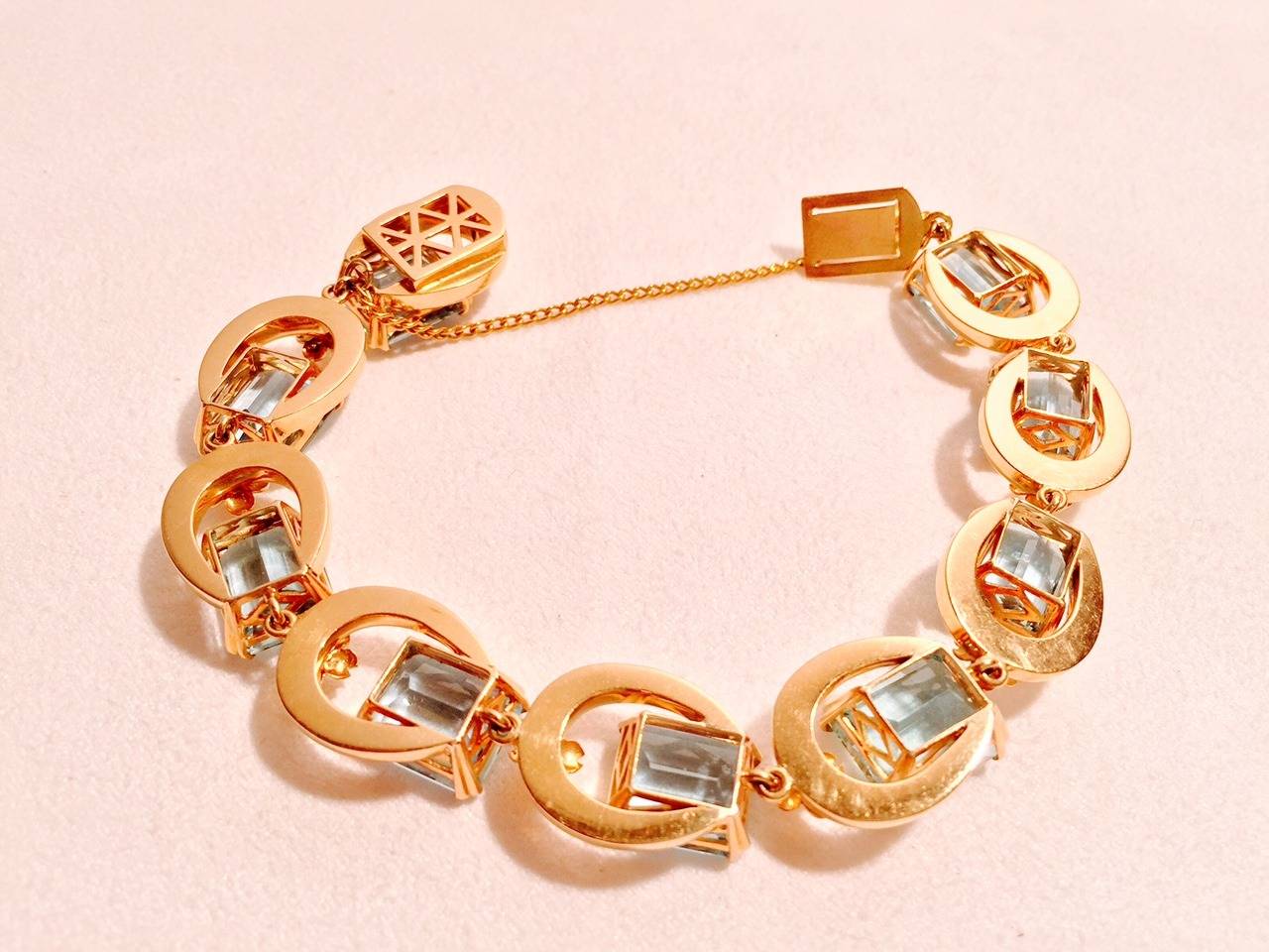 18K Gold Horseshoe Links Bracelet complements any collection of fine jewelry.  Features approximately 55 - 60 carats of gem quality aquamarines.  Rest assured...soldered safety chain box clasp provides peace of mind.