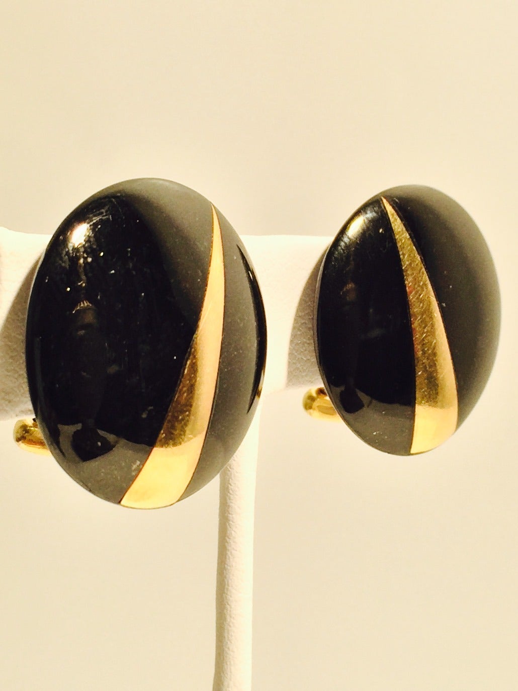 Vintage Tiffany & Co. Onyx and 18K Yellow Gold Omega Clip On Earrings are highly desired by collectors!  Properly hallmarked, these are perfect for day and  evening wear.  Onyx and 18K Gold...a perfect combination!