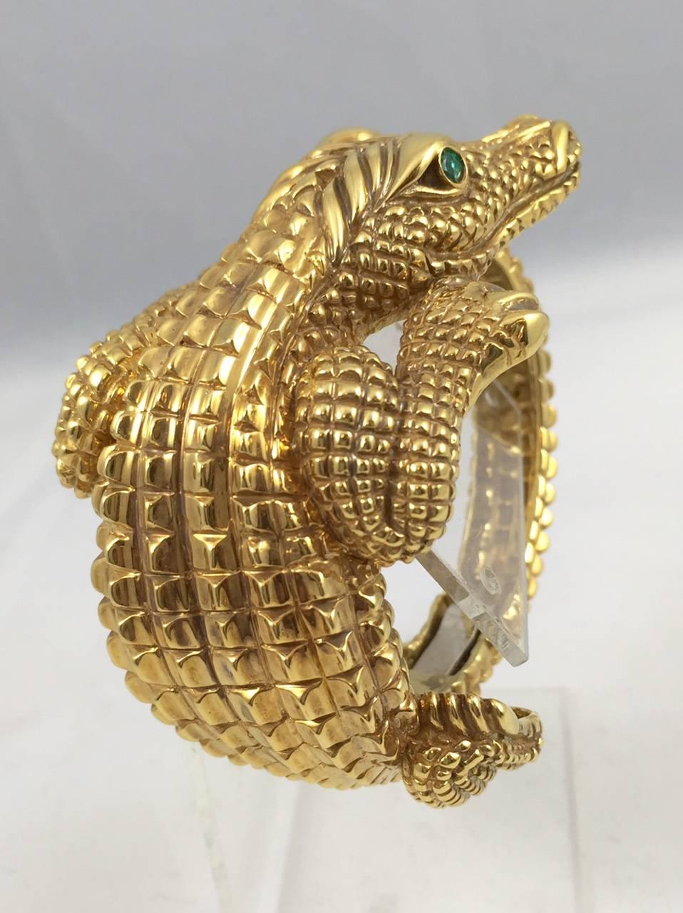 University of Florida folks and animal lovers everywhere will be drawn to this 18 karat yellow gold bracelet!  This amazing bracelet does not have one spot that isn't highly detailed!  Smartly designed with a clamper feature, it opens wide to fit