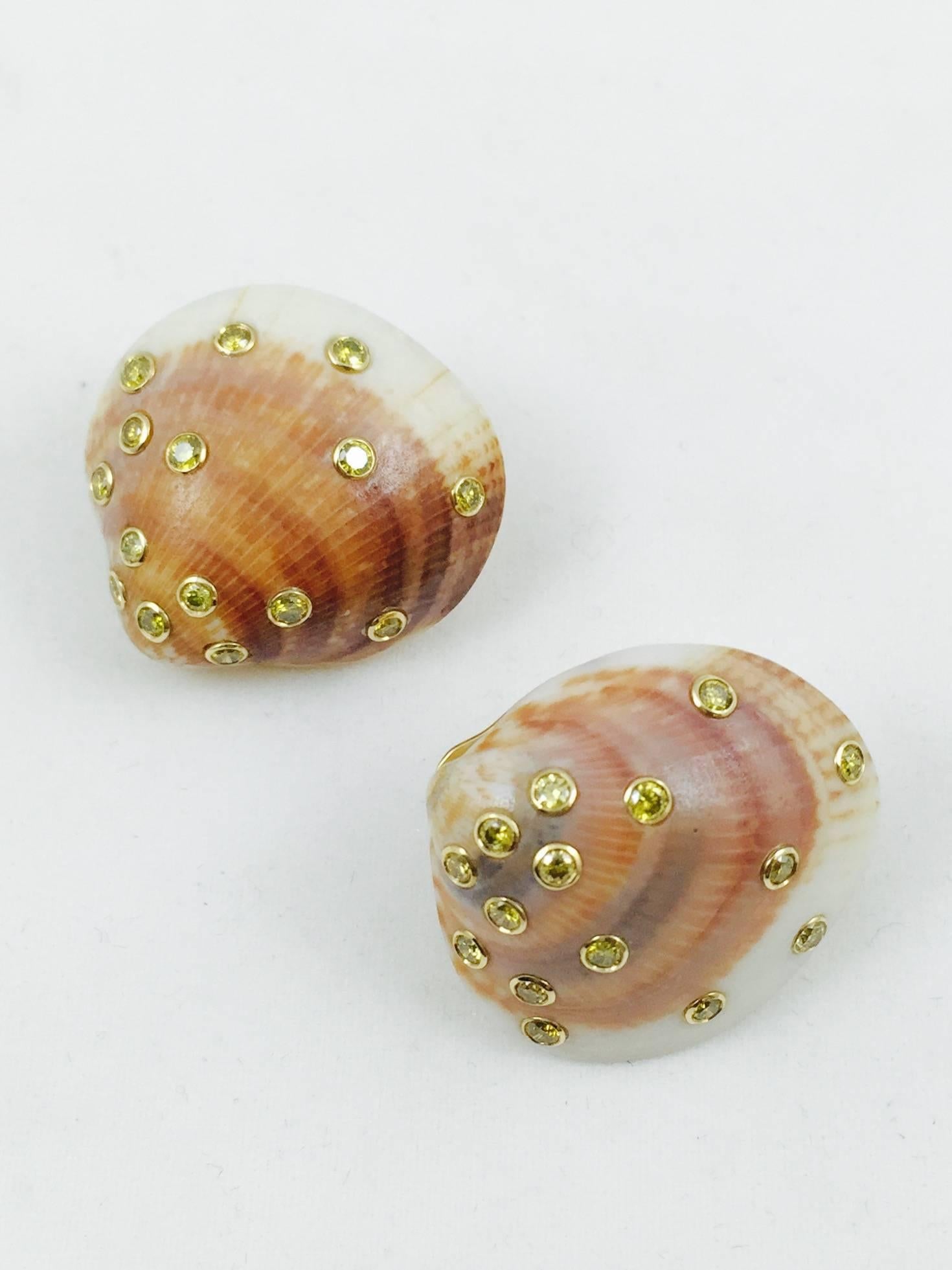 Want to hear the ocean's roar?  These magnificent shells are backed in 18 karat yellow gold with Omega back clip on. What takes these earrings to the upper levels are the bezel set Fancy Yellow Diamonds sprinkled on their surface.  34 round, fully