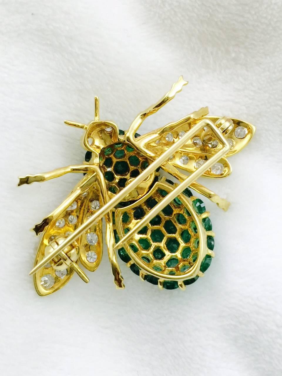 What's the buzz all about? It's all about this incredibly stunning brooch!  Artfully crafted in 18 karat yellow gold this little beauty has a body encrusted in perfectly matched emeralds having an approximate total weight of 6 carats.   Brilliant