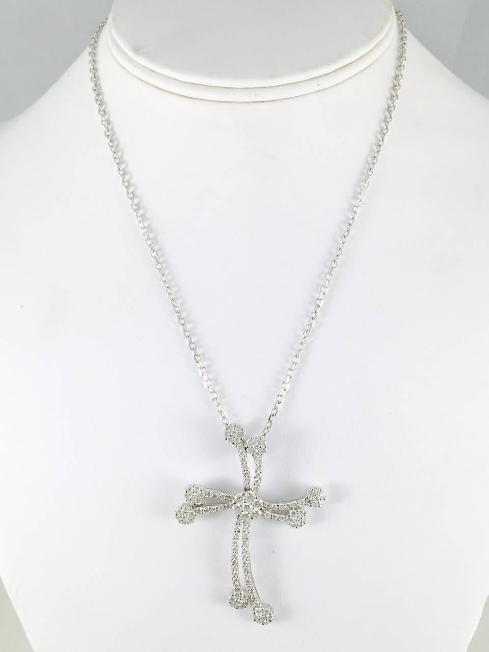 Long a symbol of Christianity, this magnificent cross has been updated into a magnificent fashion statement.  Gracefully crafted in 18 karat white gold and suspended from a 16