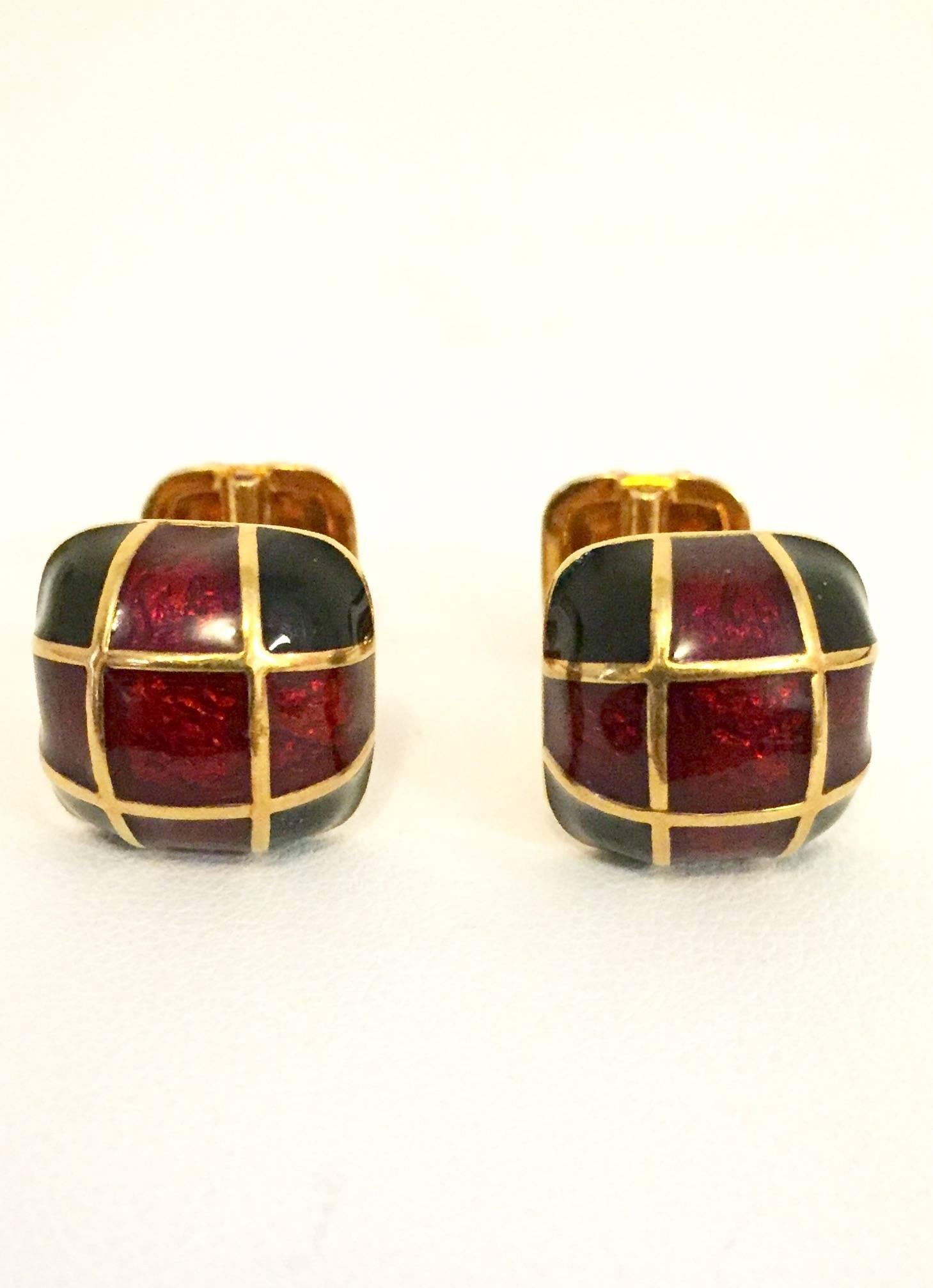From the iconic American design house of David Webb come these fabulous 18 karat cufflinks.  Their rich tradition of design, craftsmanship and creativity are displayed perfectly!  Each barbell end features a domed square in shades of rich, deep red