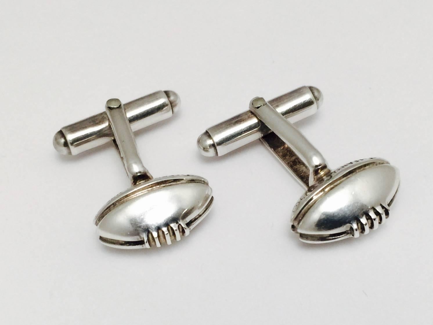 Be touchdown ready with these Tiffany sterling silver cufflinks.  Rare vintage, very good condition, a little wear on the stamp of silver grade mark 925 under magnification consistent with wear..