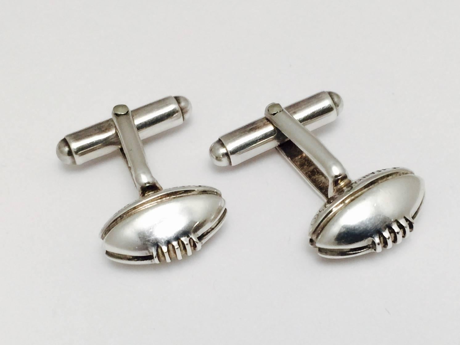 Be touchdown ready with these Tiffany sterling silver cufflinks.  Rare vintage, very good condition, a little wear on the stamp of silver grade mark 925 under magnification consistent with wear. Go team!