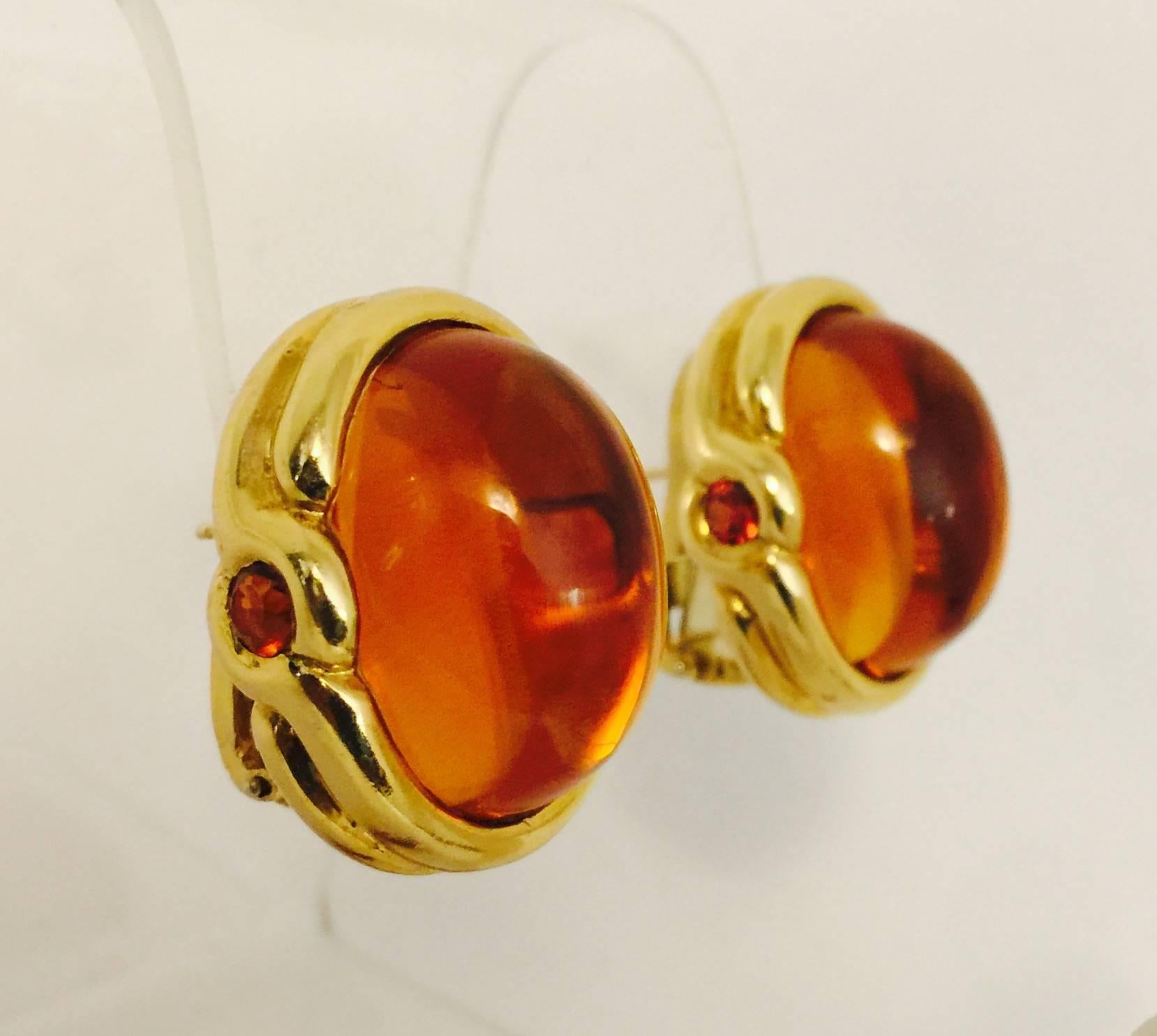 18K yellow gold frames cradle spectacular cabochon Palmeira Citrines the color of fine Cognac.  Visible on each side are bezel set, faceted orange Topaz.  Colors are stunning together! Omega back pierced earrings are easily converted to clip on. 