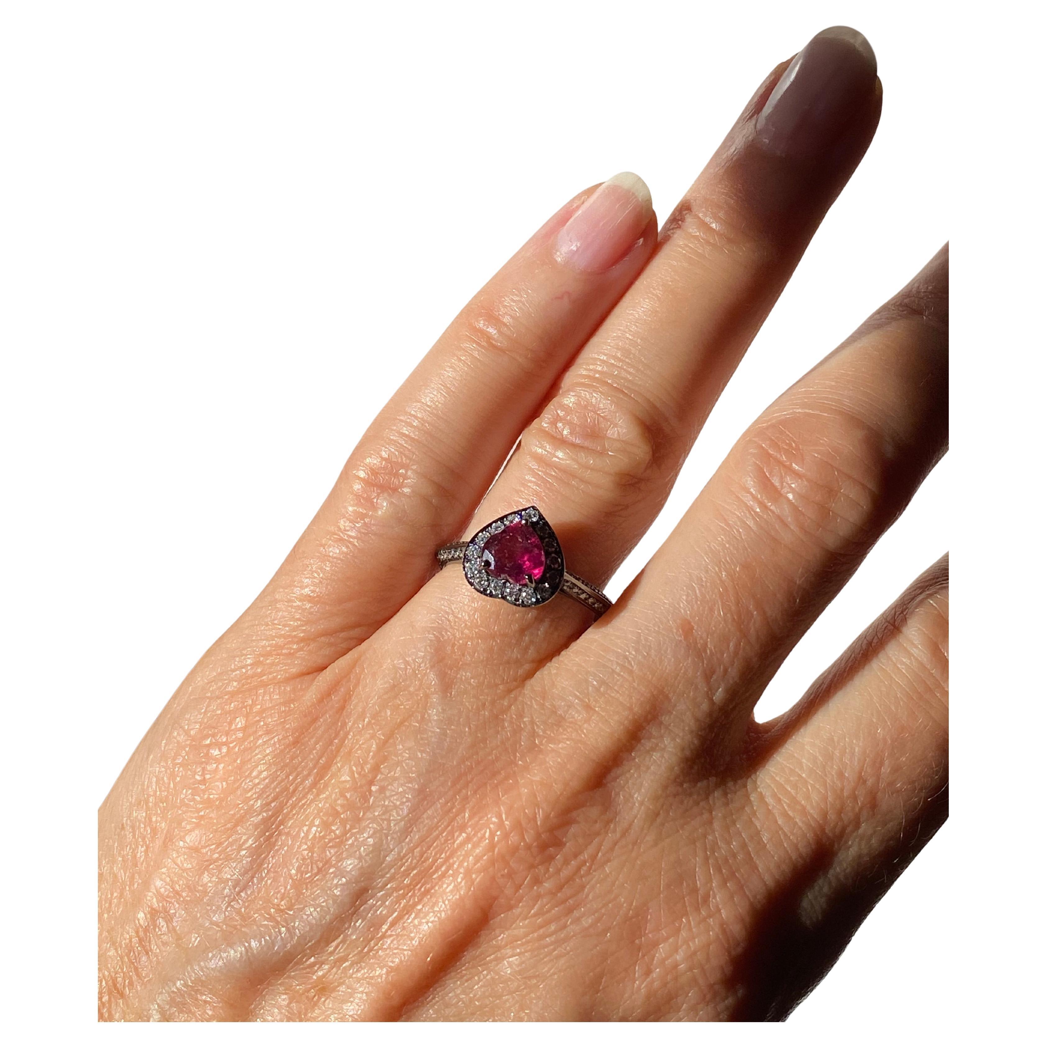 Rossella Ugolini Design Collection Classy heart shaped Rubelite set on a 18k White Gold black rhodium ring embellished with 0.50 Karats White Diamonds.  Available also in total white 18 k gold. Rubellite is the stone of Love, a truly exclusive gem.