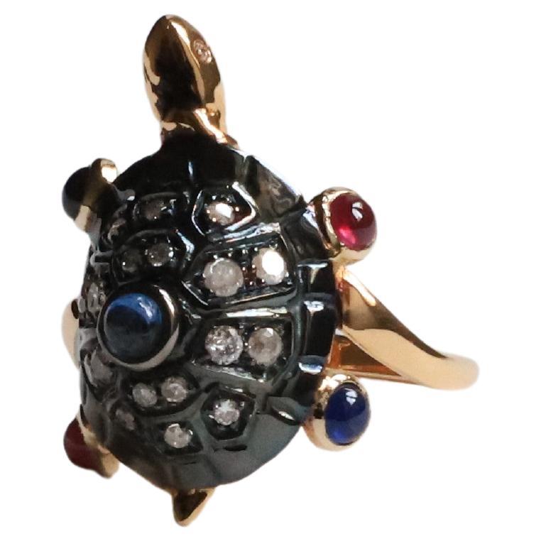 Turtle 0.50 Karats Diamonds 0.60 Kt Sapphires 0.35 Karat Ruby 18 Karat Gold Ring