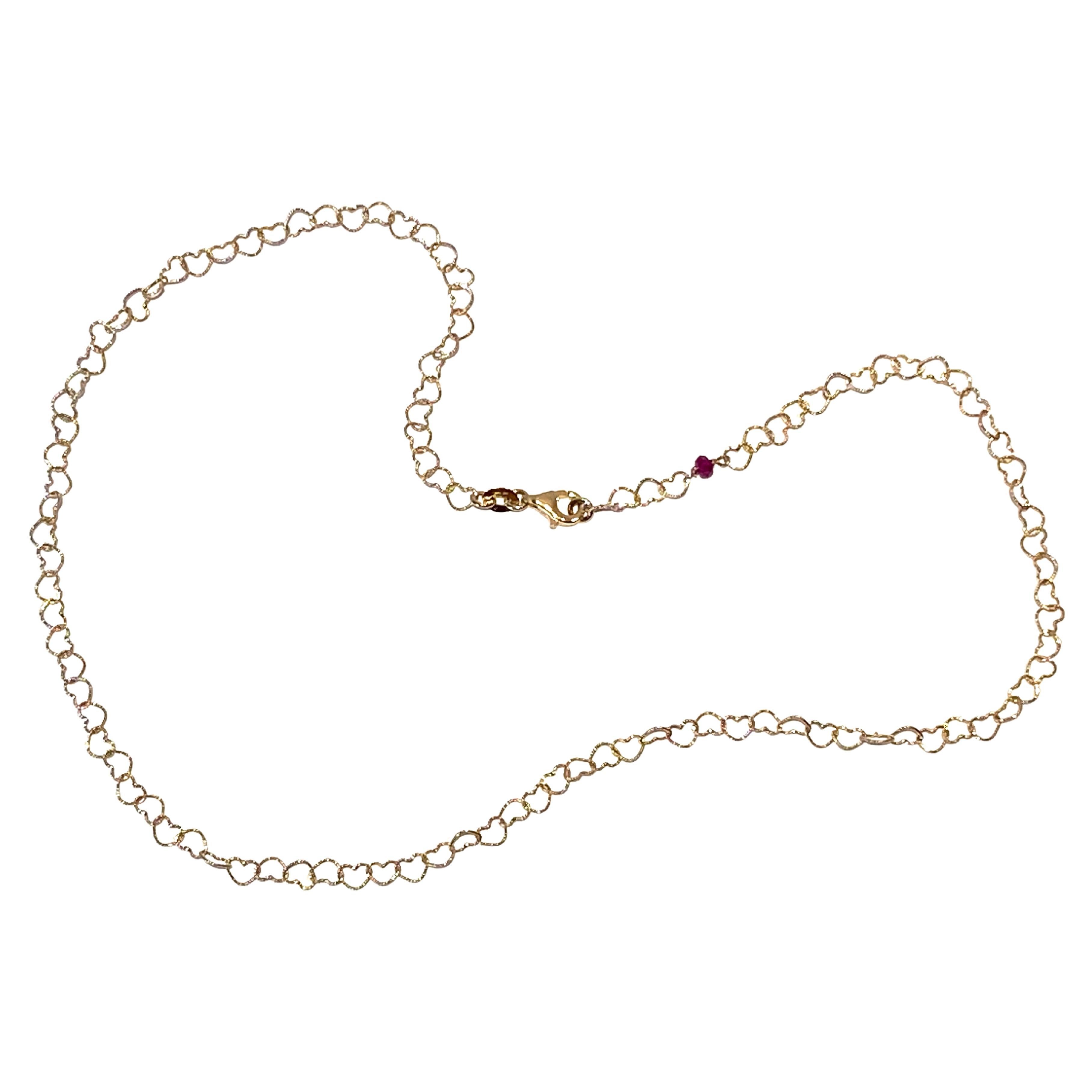 Oval Cut Dainty 18 Karat Yellow Gold Red Ruby Slightly Hammered Little Hearts Necklace For Sale