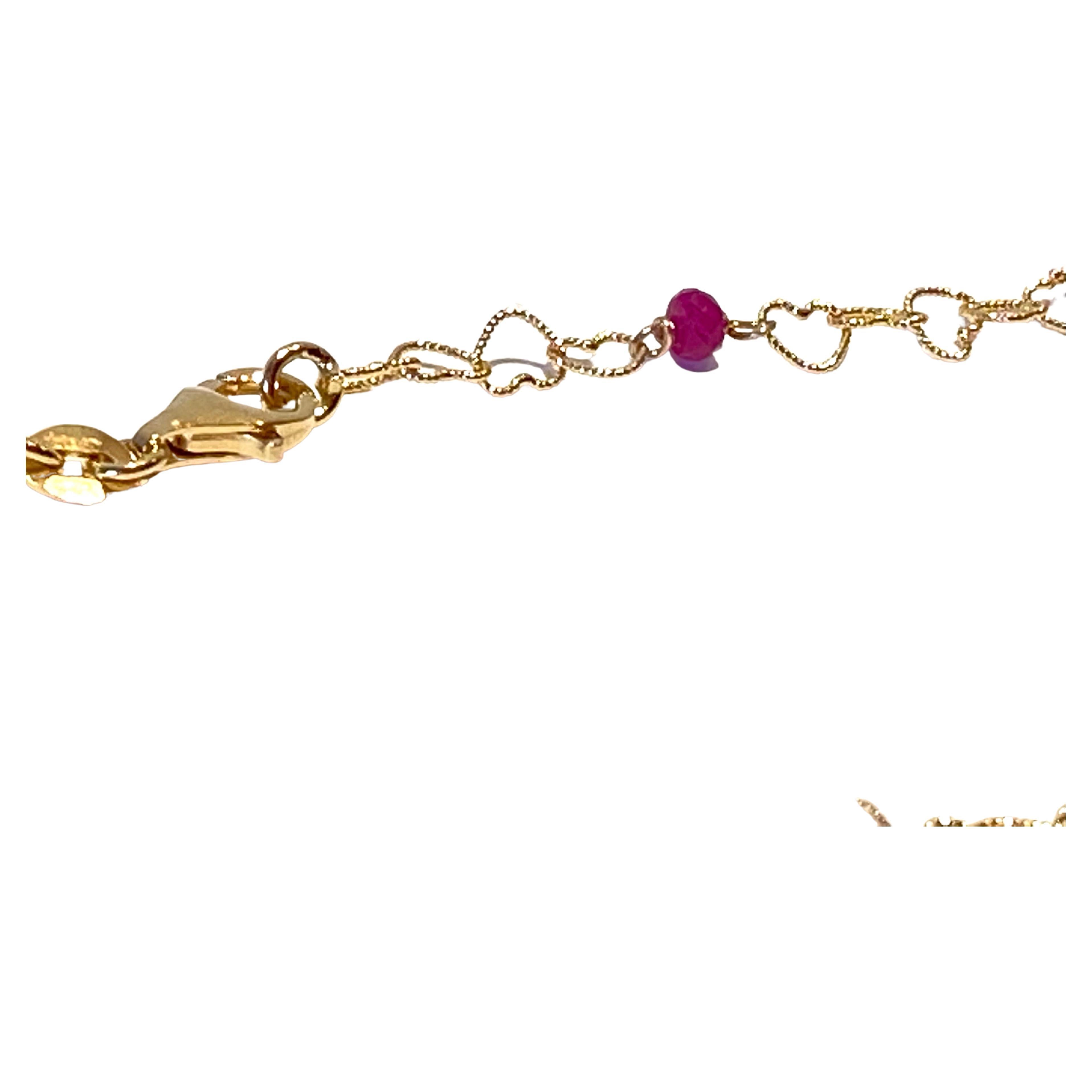 Dainty 18 Karat Yellow Gold Red Ruby Slightly Hammered Little Hearts Necklace For Sale