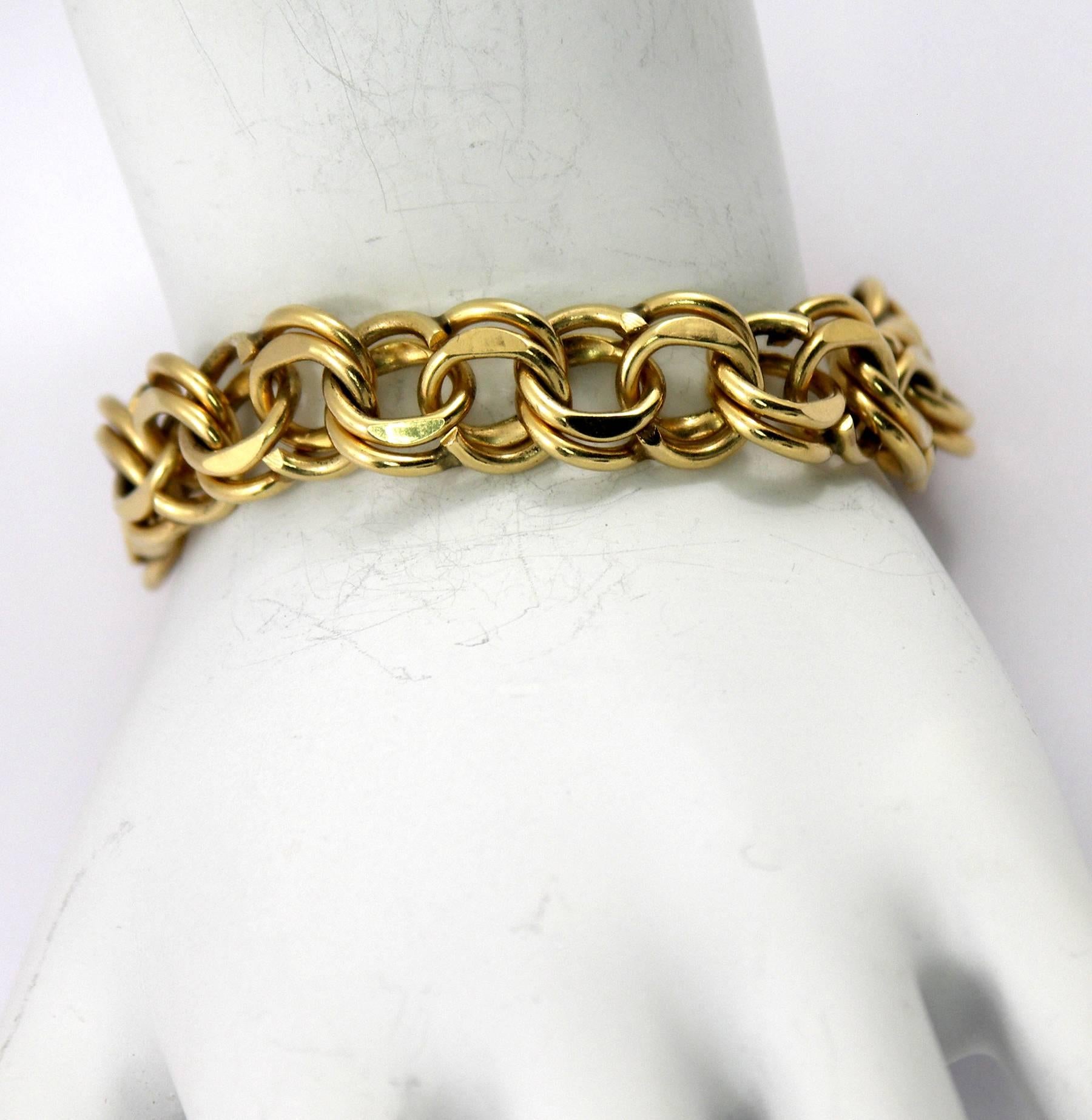 One 14K yellow gold double spiral link bracelet measuring 7/16 inches wide and 7 1/2 inches long. A beautiful bracelet often used for hanging charms.