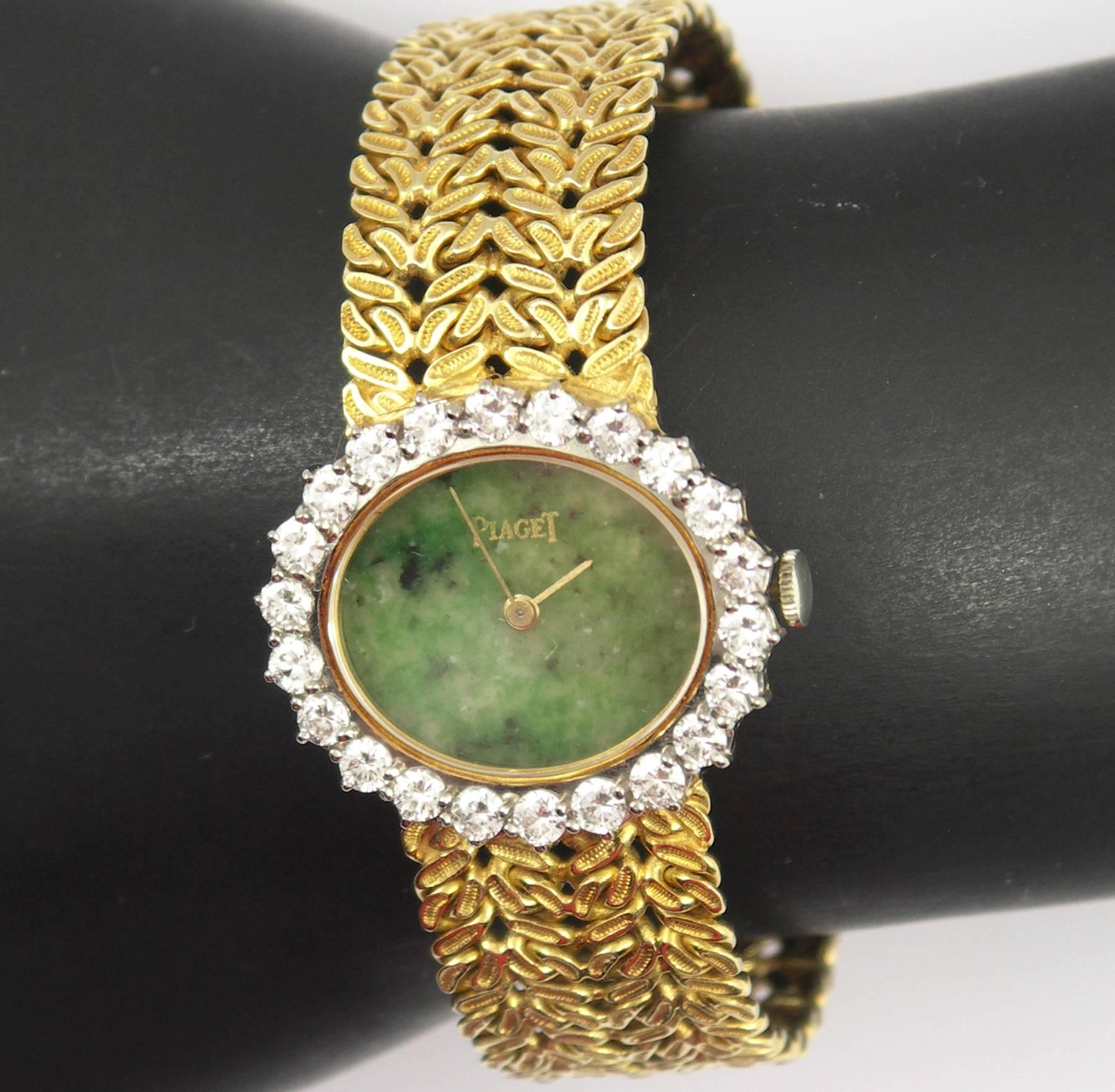 A ladies yellow gold, Piaget wristwatch with a jade dial measuring 17mm X 21mm. Encircling the dial are 22 round brilliant cut diamonds weighing 2.25ct total approximate weight of F color and VVS2/VS1 clarity. The overall measure of the diamond