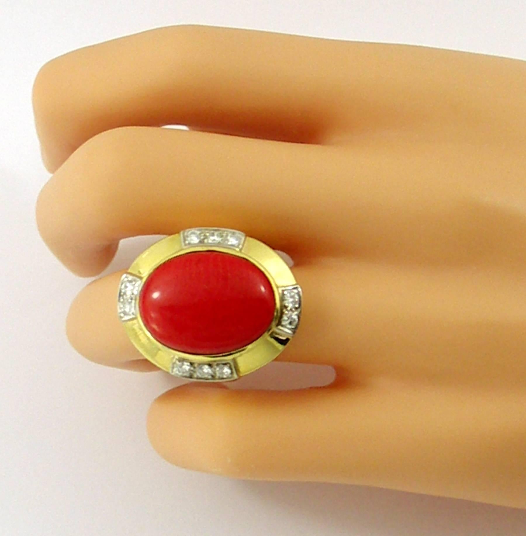 One 18K yellow gold ring signed R. Stone, and set with an oval cabochon coral measuring 20mm X 15mm. It is also set with 10 Round brilliant cut diamonds with a total weight of approximately 0.65ct of overall G color and VVS2/VS1 clarity.
Ring Size 8