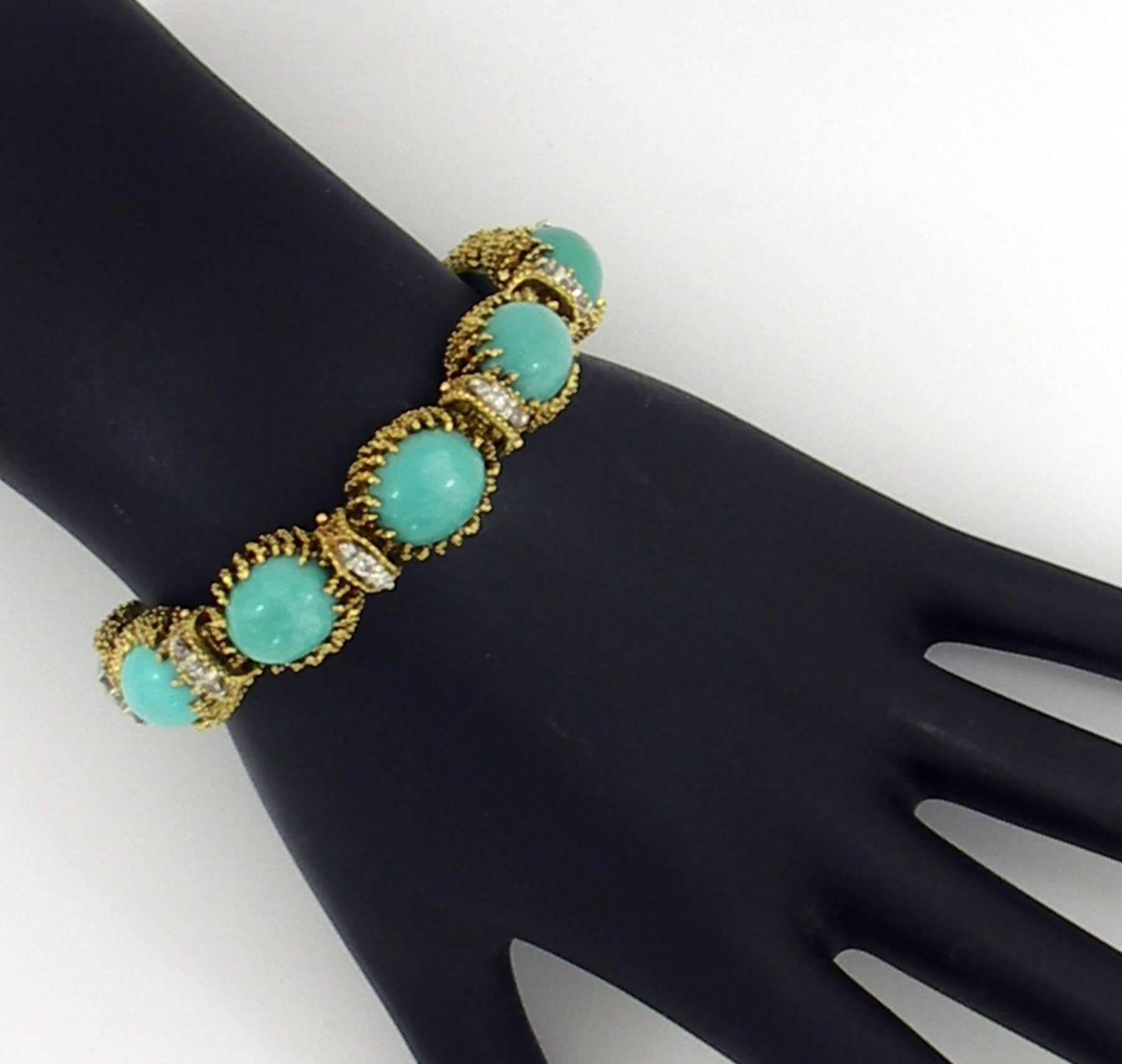 An organic inspired La Triomphe bracelet, comprised of 10 links set with turquoise, and 10 diamond sections. Each turquoise is Persian in color, and measures 13mm X 10mm. The wire design of the links is continued in the diamond connectors, which are