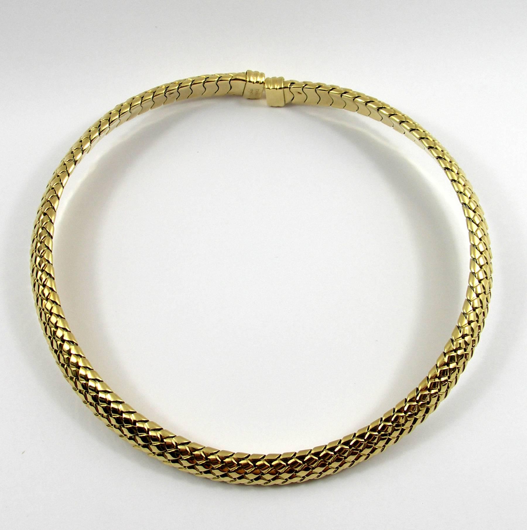 An 18Kt. woven design, collar necklace measuring 10mm wide, with a circumference of 13 inches signed Tiffany & Co.
