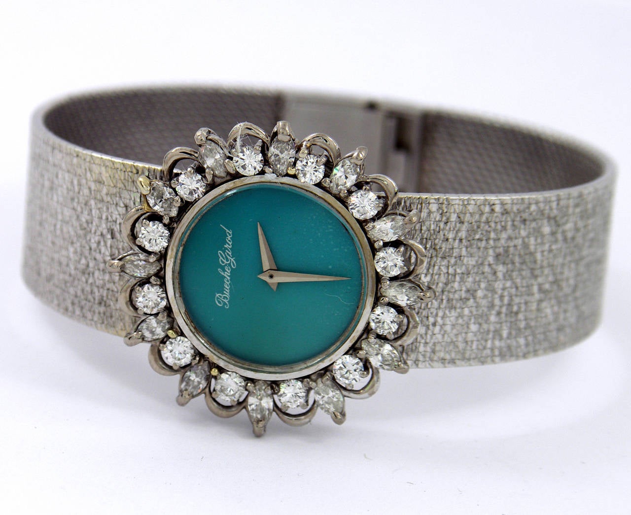 18K white gold, ladies Bueche Girod wristwatch featuring a Persian turquoise dial. The bezel is set with alternating round brilliant, and marquise cut diamonds. Total approximate weight of diamonds is 2.5ct, of F-H color, and VS1/VS2 clarity. The