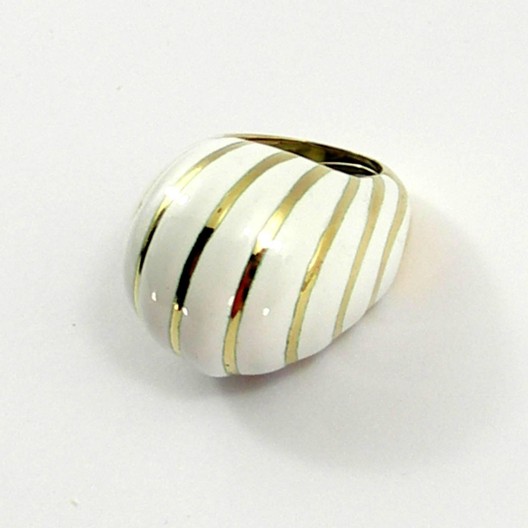 One 18K yellow gold dome ring rising 5/8 of an inch tall, and enameled in white, in a twisted design. Ring is a size 5 1/2, and weighs 23.1 grams. Signed Webb for David Webb.