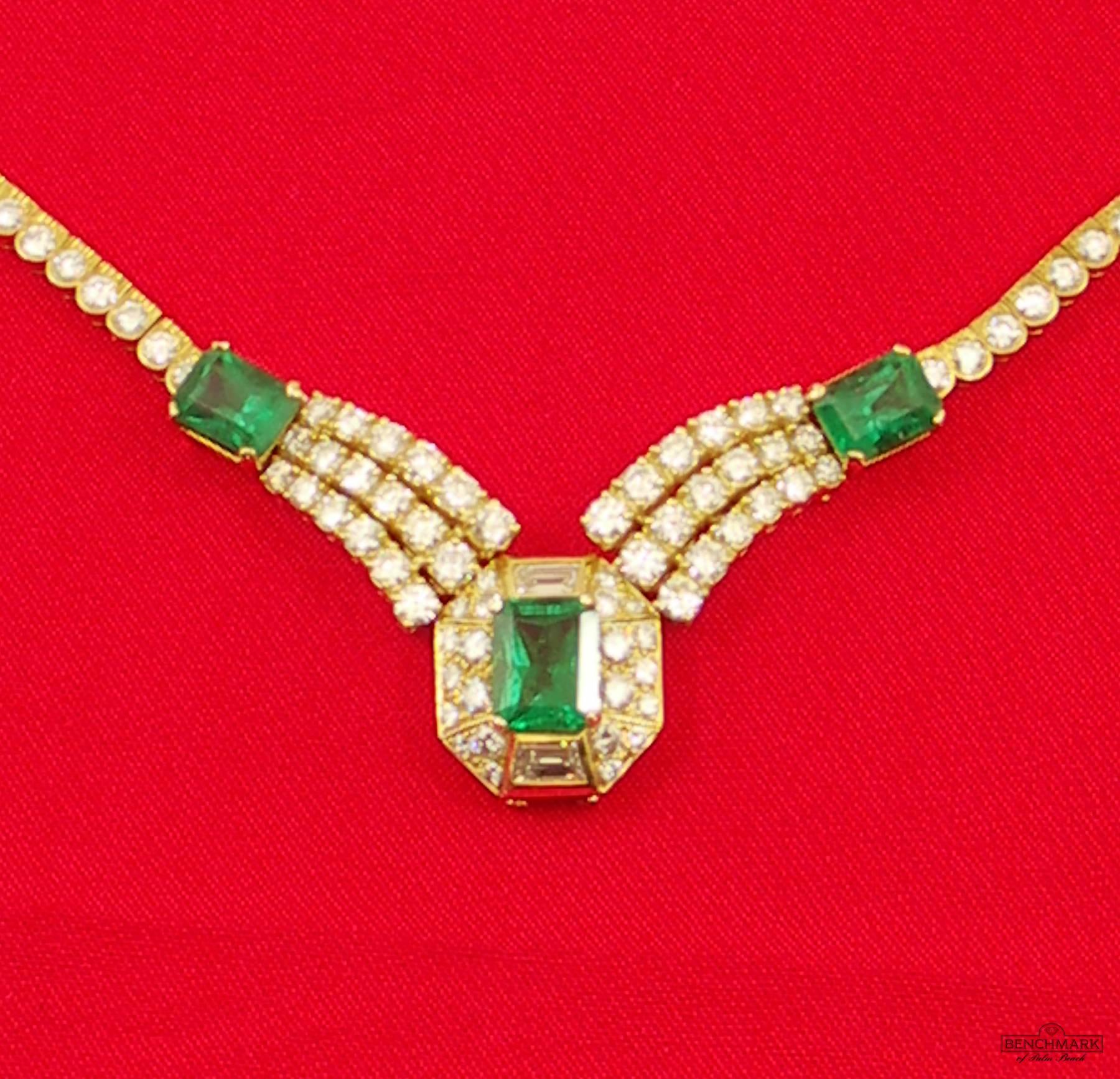 An 18 karat yellow gold necklace, centered around an emerald cut emerald weighing 3.38ct, as described in A.G.L. certificate #1088611, as being of Zambian origin, and absent of enhancements. Surrounded by 22 round brilliant cut diamonds weighing