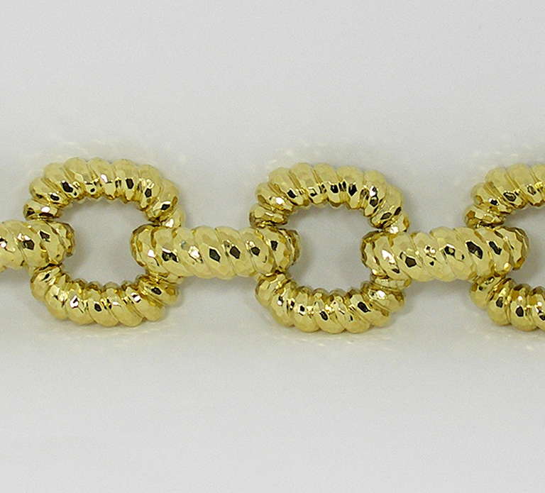 One 18K yellow gold bracelet comprised of open links measuring 1.25 inches wide, and connecting links measuring 0.38 inches wide. Beautifully hammer finished, this bracelet closely resembles the works of Webb or Dunay, but bears no signature. This
