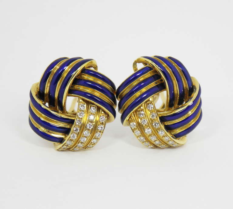 One pair of 18K yellow gold earrings comprised of four sections each. Three of the sections are each contoured, with three beautifully enameled ribs. The fourth section of each earring is set with three rows of round brilliant cut diamonds, for a