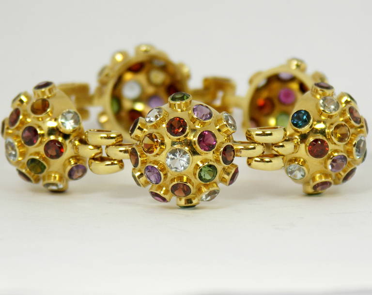 One 18K yellow gold bracelet comprised of three hemispherical 