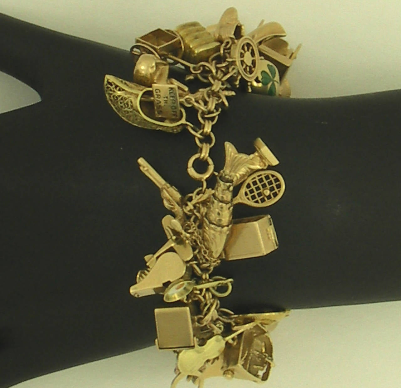 Gold Bracelet Loaded with Charms In Excellent Condition In Palm Beach, FL