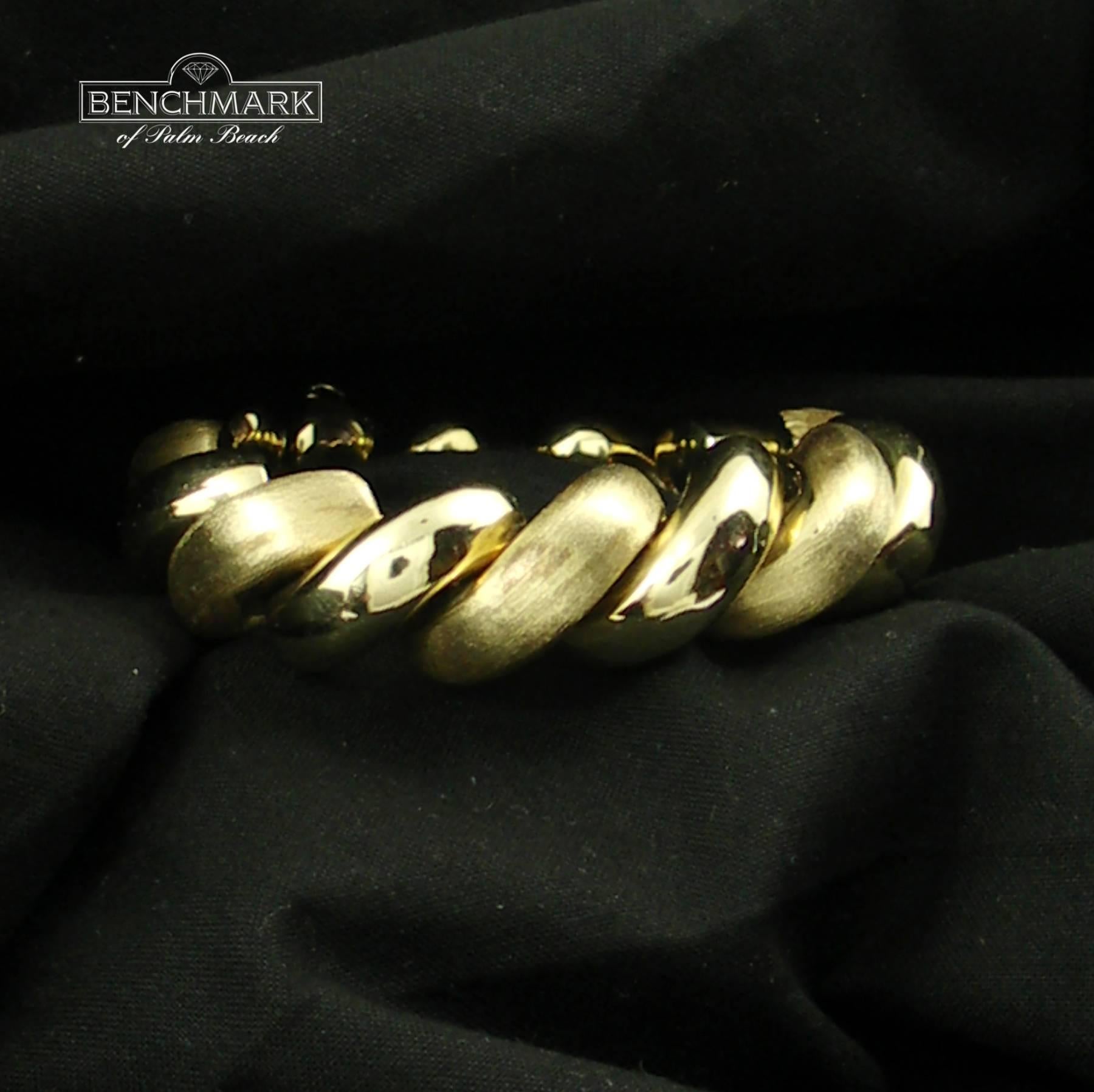 A 14K yellow gold San Marco link bracelet, with alternating links of Florentine finish, and high polish finish, measuring 3/4 of an inch wide, with an inside circumference of 6 1/2 inches.