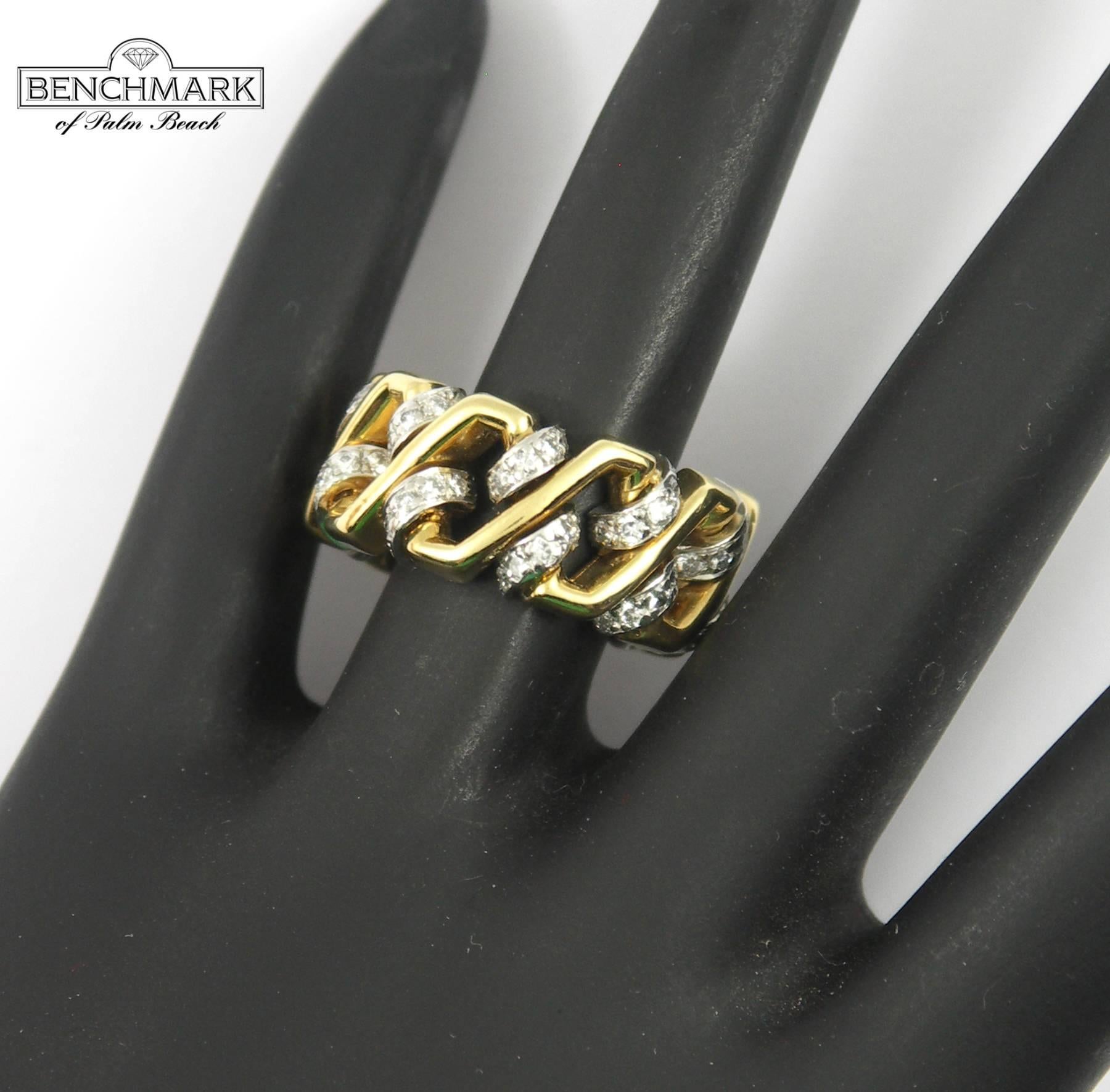 A ladies band ring measuring 3/8 of an inch wide; constructed in 18K yellow gold, with platinum stations, pave' set with diamonds. Diamonds weigh one carat total approximate weight of overall F color and VS1 clarity. Signed David Webb. 
Ring size 5