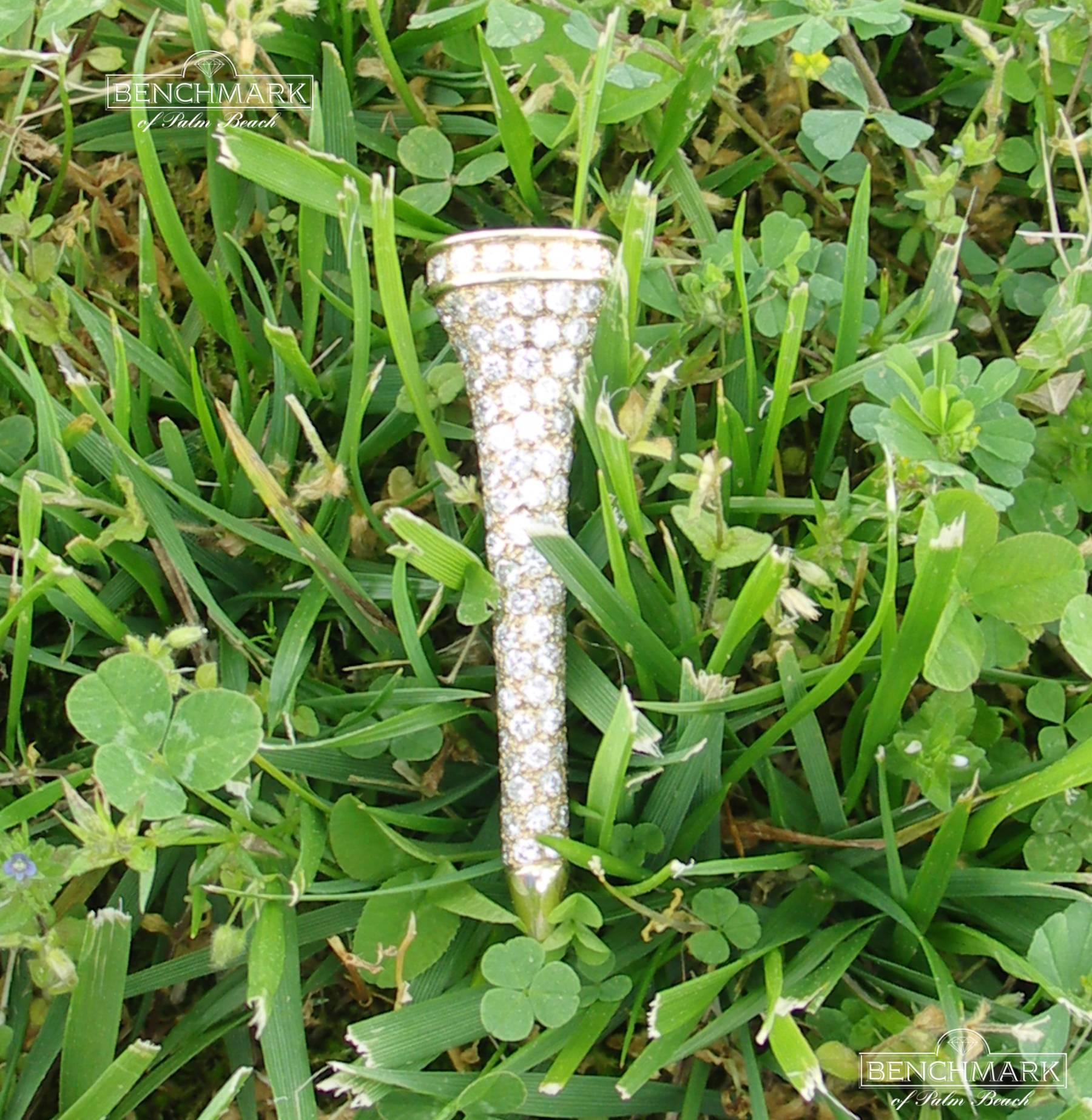 A 14K yellow gold brooch, beautifully pave' set with a total of approximately 5.5ct of round brilliant cut diamonds of overall G color and VVS2/VS1 clarity. This striking golf tee brooch measures just under 3/4 of an inch wide, and 2 1/2 inches