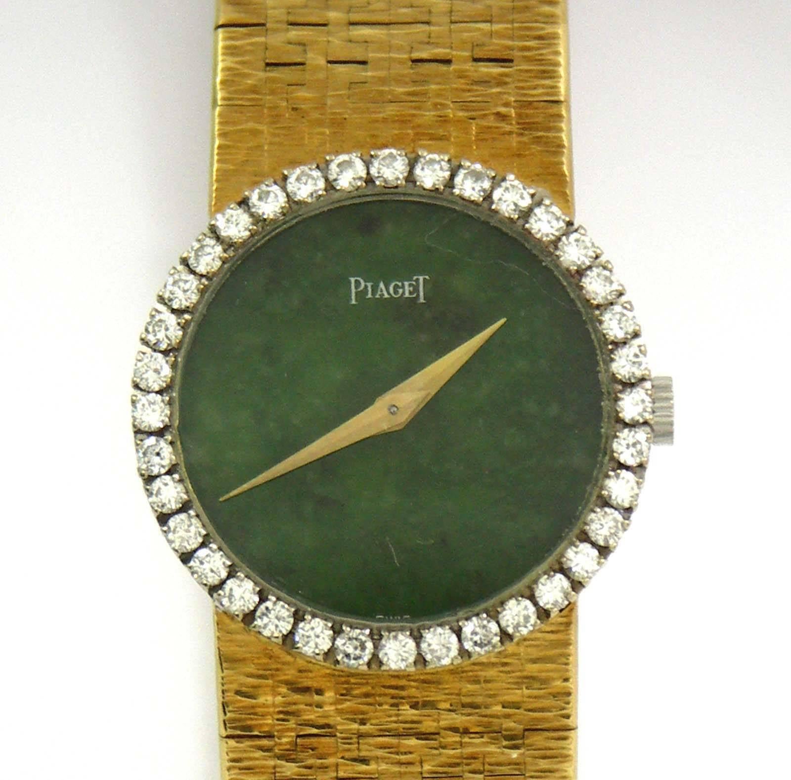 A lady's 18K yellow gold watch centered around a green jade dial, with a bezel measuring 24mm in diameter, and set with 30 round brilliant cut diamonds weighing 1.15ct total approximate weight. Signed Piaget