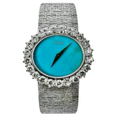 Montre Piaget Vintage pour dames en or blanc avec cadran turquoise et lunette en diamant