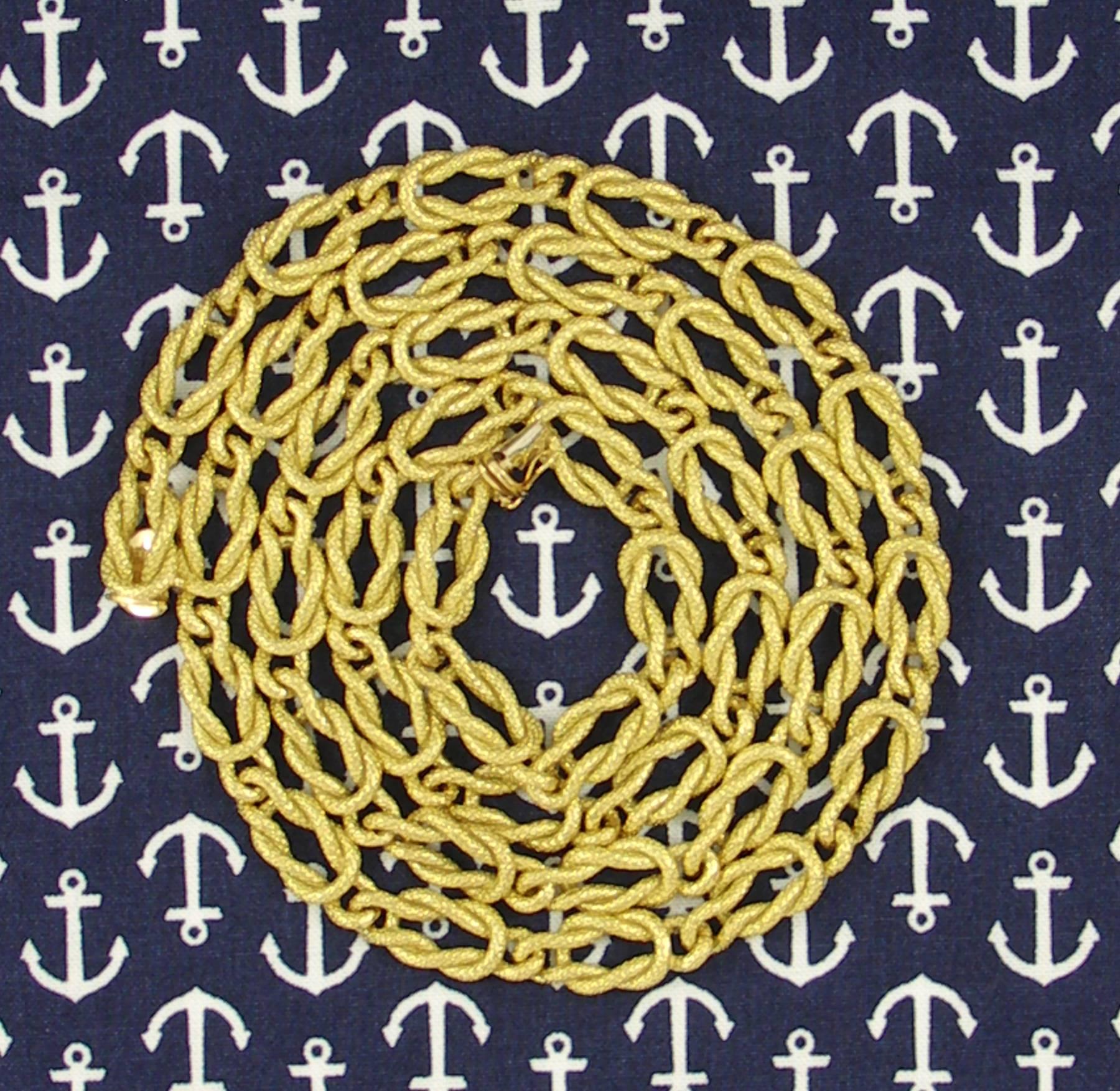 An 18K yellow gold necklace comprised of 40 links styled after the nautical, square knot. Each link measures 3/8 of an inch wide and 1 inch long, for an overall length of 32 inches.