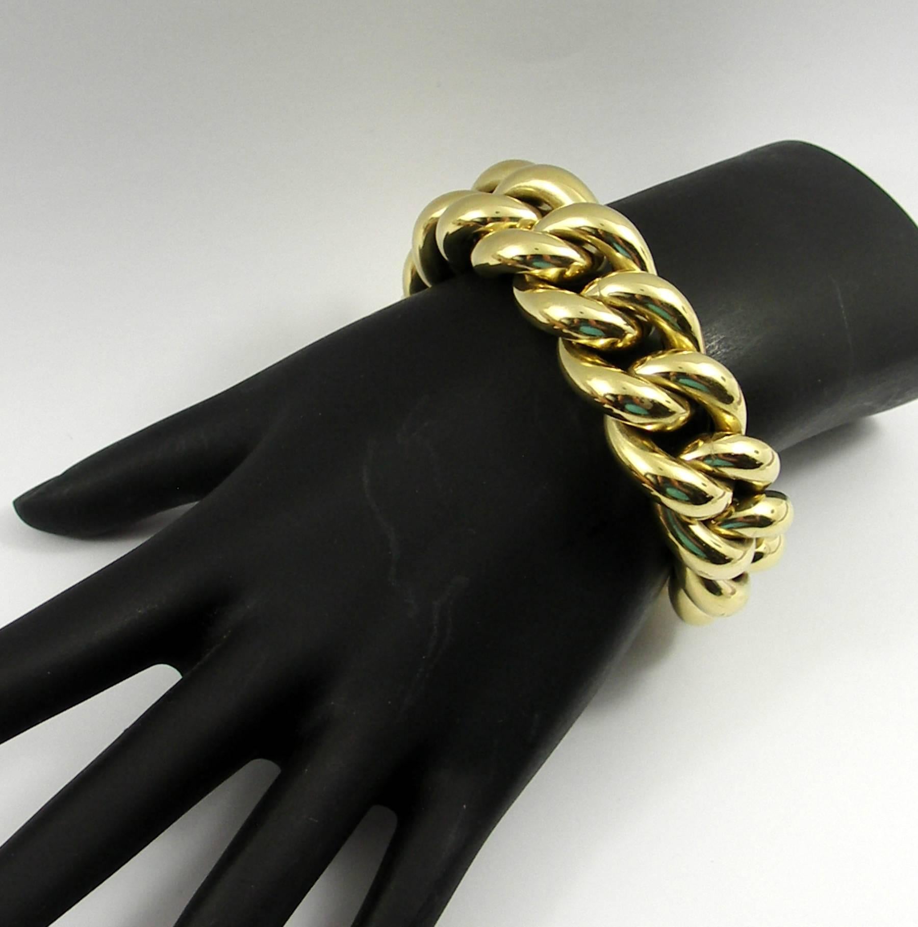 A 14K yellow gold, rounded curb link bracelet comprised of 15 links, each measuring 3/4 of an inch wide. Bracelet is hallmarked Vicenza Italy, and inside circumference is 6 1/2 inches.