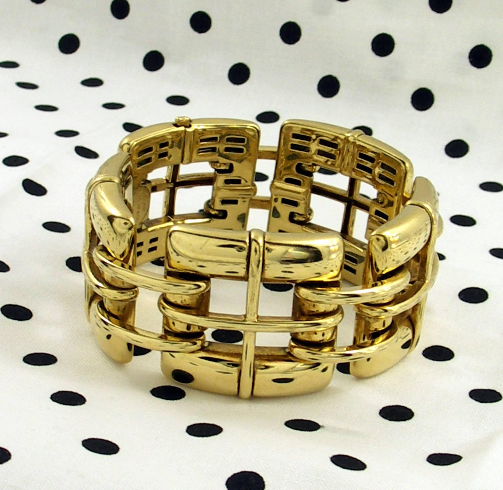 One ladies 18 karat yellow gold bracelet measuring  1 1/4 inches wide and 7 1/2 inches long. This stylish bracelet is comprised of five open links, known as the Biscayne model by Tiffany and Co.
