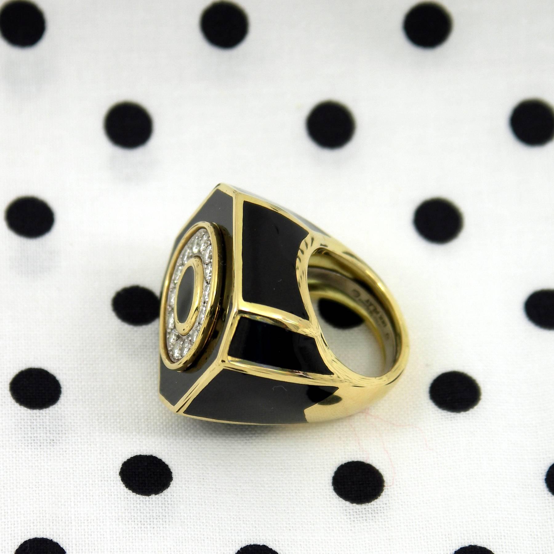 Big, bold and beautiful, this striking David Webb ring is made of 18K Yellow Gold with black enamel markings. The 14 round brilliant cut diamonds are
set into an oval shaped, platinum plate surrounded by a yellow gold channel.
The diamonds weigh
