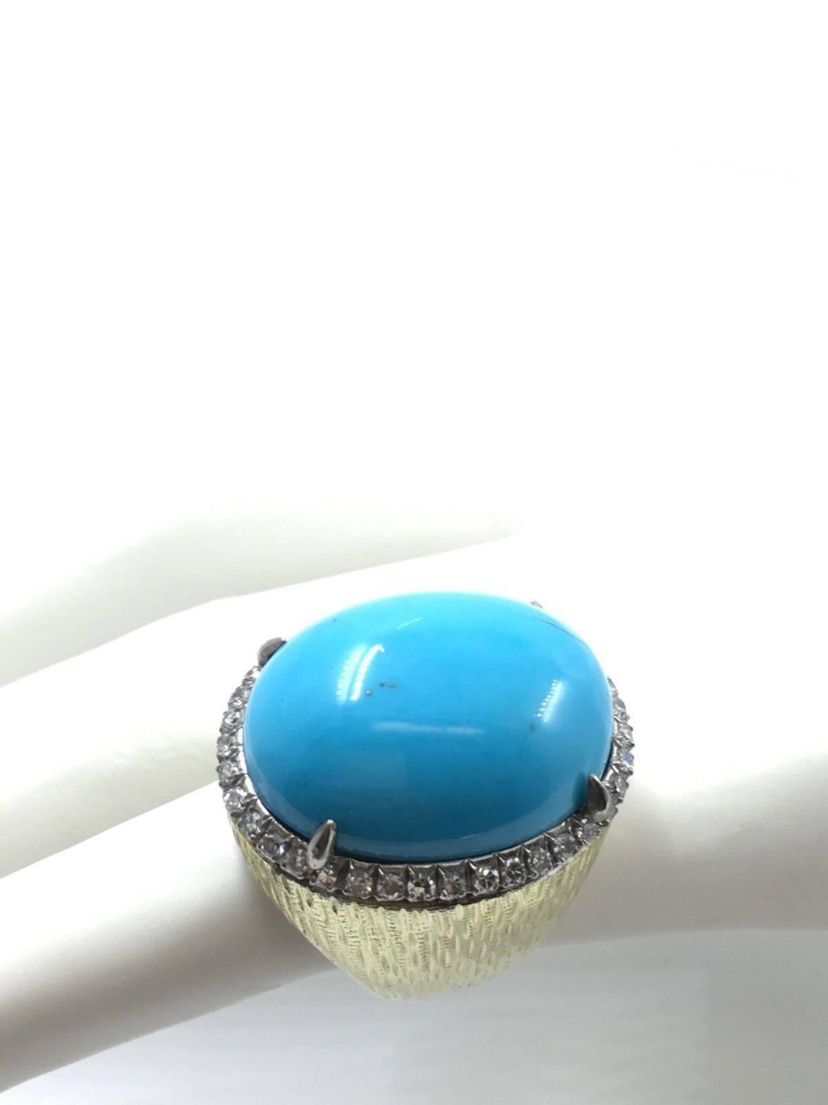 A Magnificent Persian Turquoise
Fine gold mount and a stunning large stone. Sure to become your favorite cocktail ring! 
Very RARE find
The turquoise has an intense, yet very pleasant colour and a sporty curveous shape, which makes the ring very