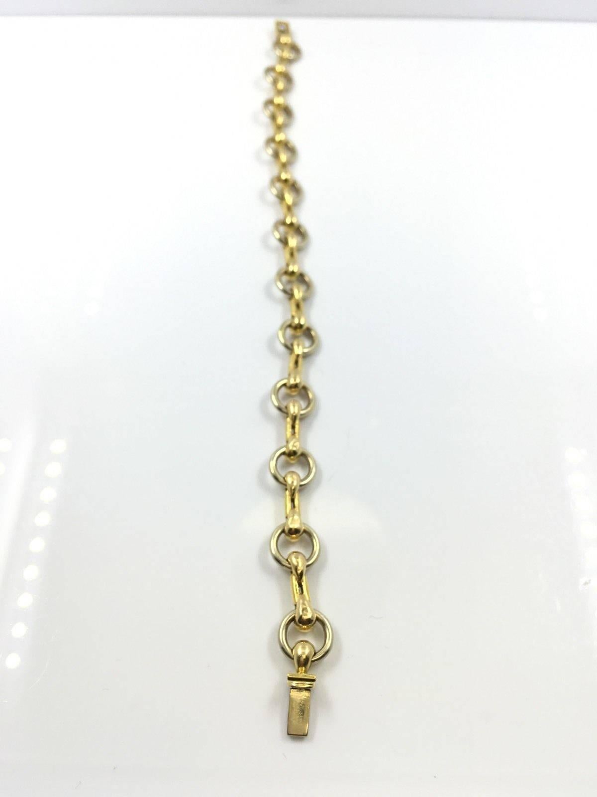 Cartier 18K Two Tone Gold Chain Link Designer Bracelet

This authentic Cartier bracelet is finely crafted from solid 18k yellow and white gold. It features a very attractive chain link design which looks absolutely fabulous on the wrist. It is