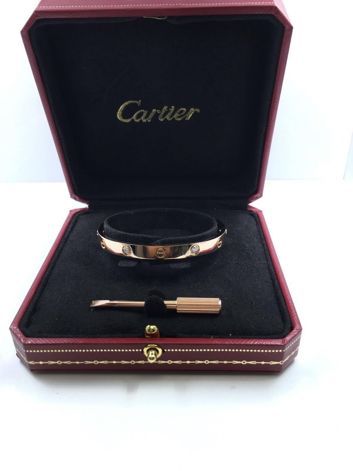 
This Cartier Love Bracelet, featuring 18k rose gold with 4 diamonds, is a classic, highly coveted Love bracelet by prestigious jeweler Cartier. This beautiful bracelet is a signature Cartier piece, and can be worn day and night. This bracelet was