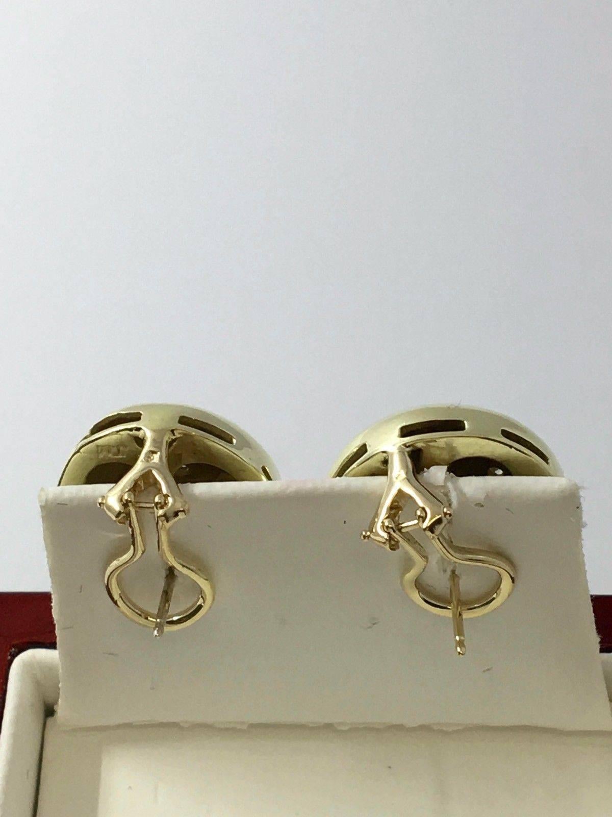 These fancy 14K yellow gold clip earrings.Featuring a dome modern design, encrusted with 14 genuine round diamonds approx: 0.14cttw, I-J color, VS-SI clarity, flush set. Made for pierced ears with security push backs, these earrings remain in very
