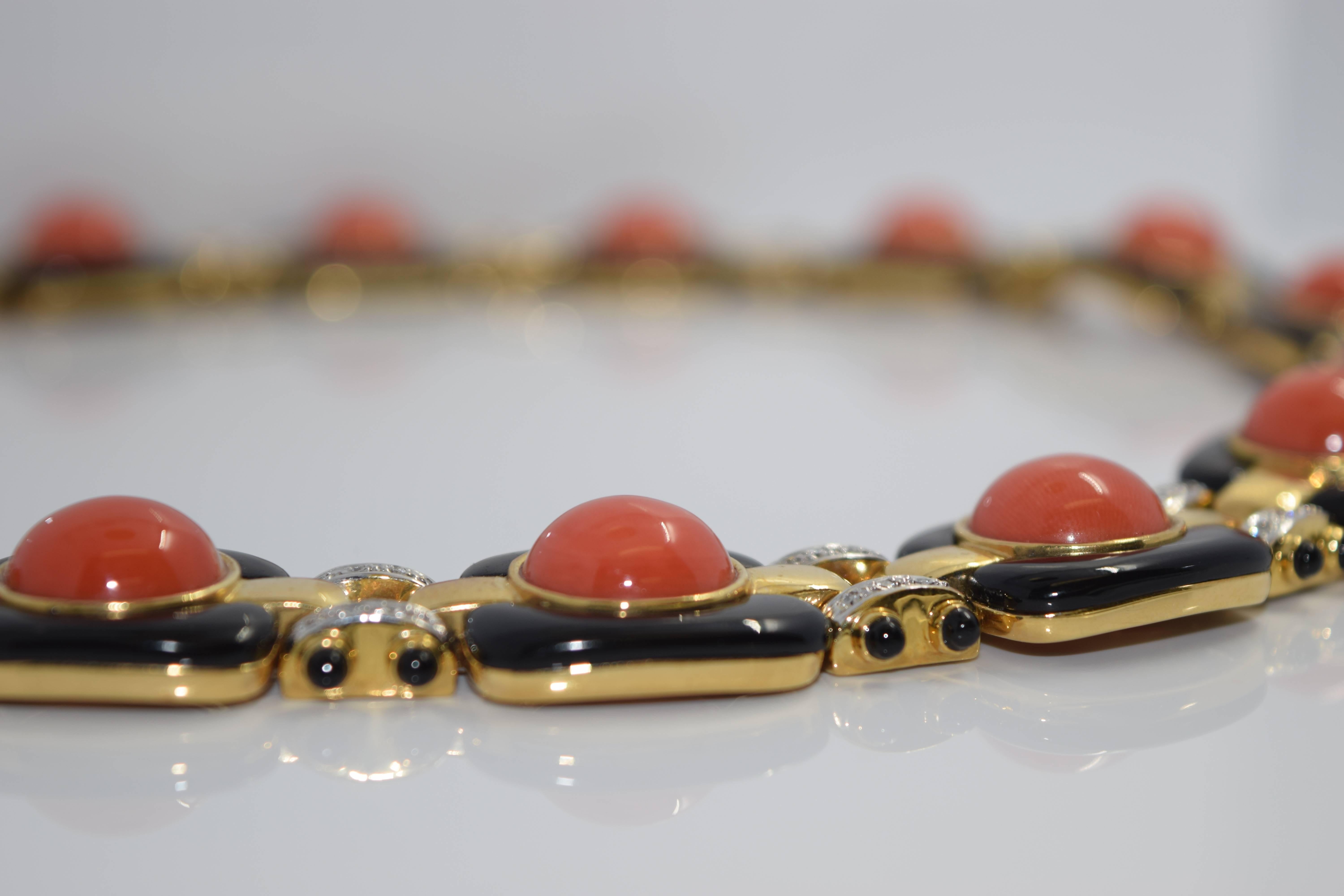 Absolutely stunning coral, onyx, and diamond 3 piece set. Can be worn all together, or individually. Each piece alone is uniquely magnificent in its craftsmanship and design. The coral is perfectly placed in the center of each onyx piece, linked by