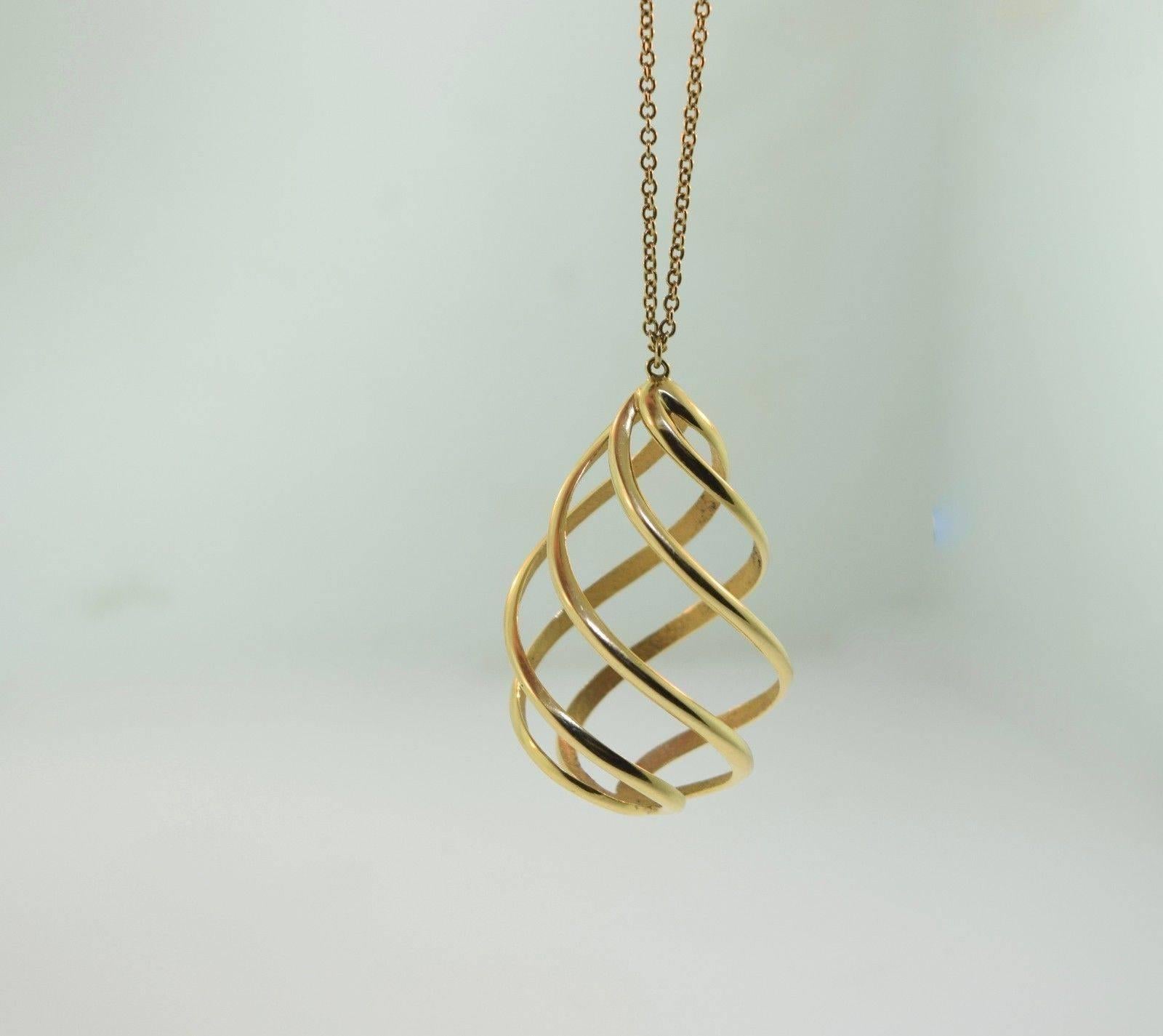 Tiffany & Co. Gold Swirl Spiral Necklace Pendant  In Excellent Condition In Miami, FL