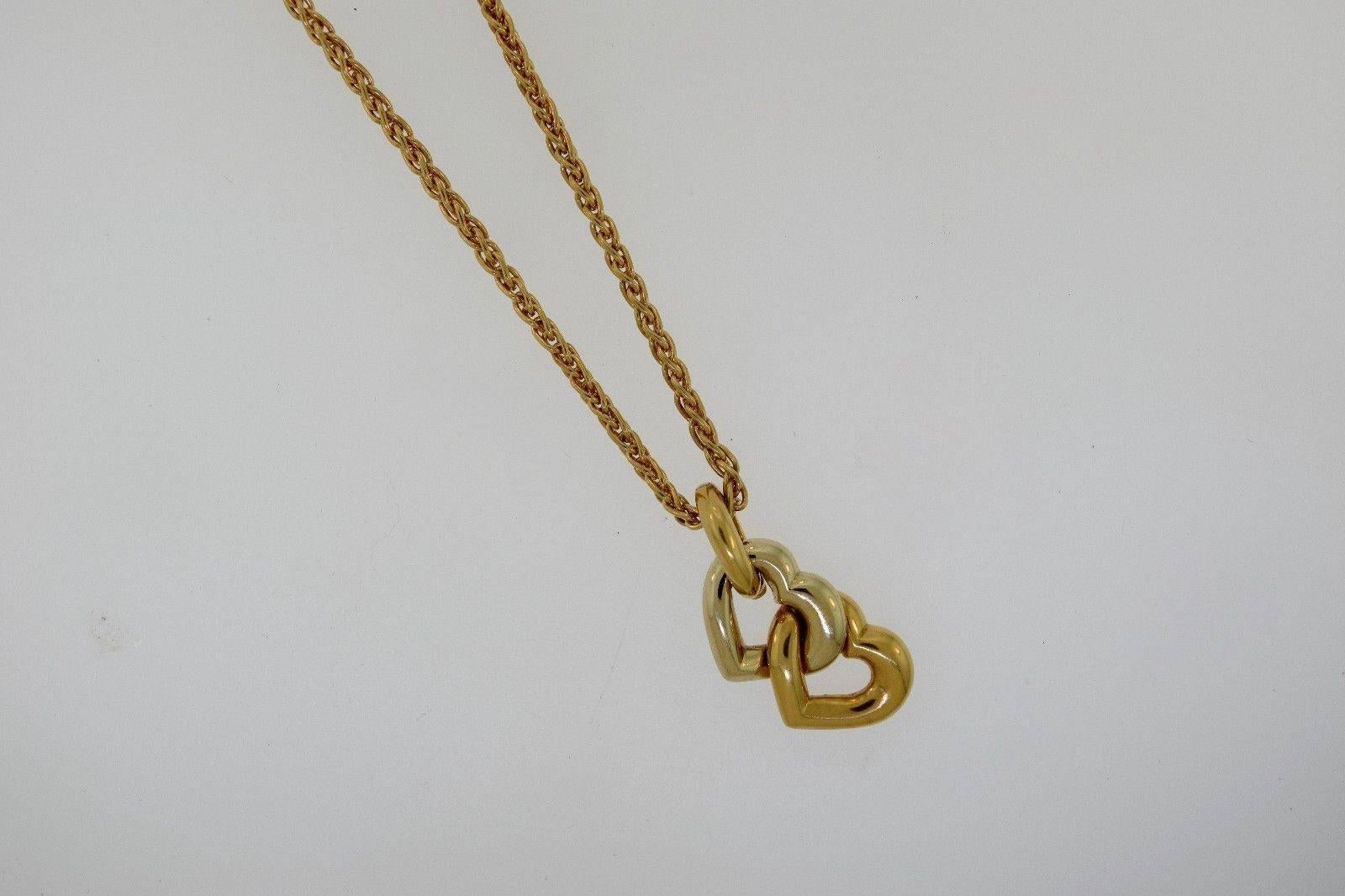 Description: 

18K yellow gold and 18K white gold Cartier rolo chain necklace with double linked heart pendant and ring closure. Includes box.

Metal Type: 18K Yellow Gold, 18K White Gold

Hallmark: Cartier, Serial #

Signature: Cartier,