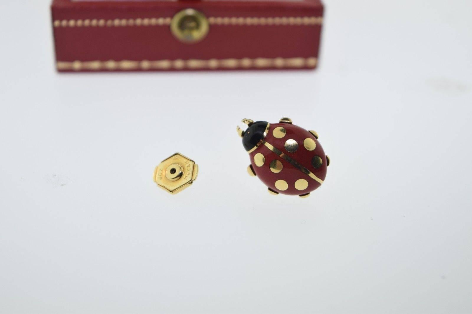 100% guaranteed authentic Cartier vintage ladybug brooch in gold and enamel. Hallmarks and signatures included in photos. This brooch is perfect and adorable for everyday wear. It is chic and stunning, and a classic Cartier standout piece. Comes